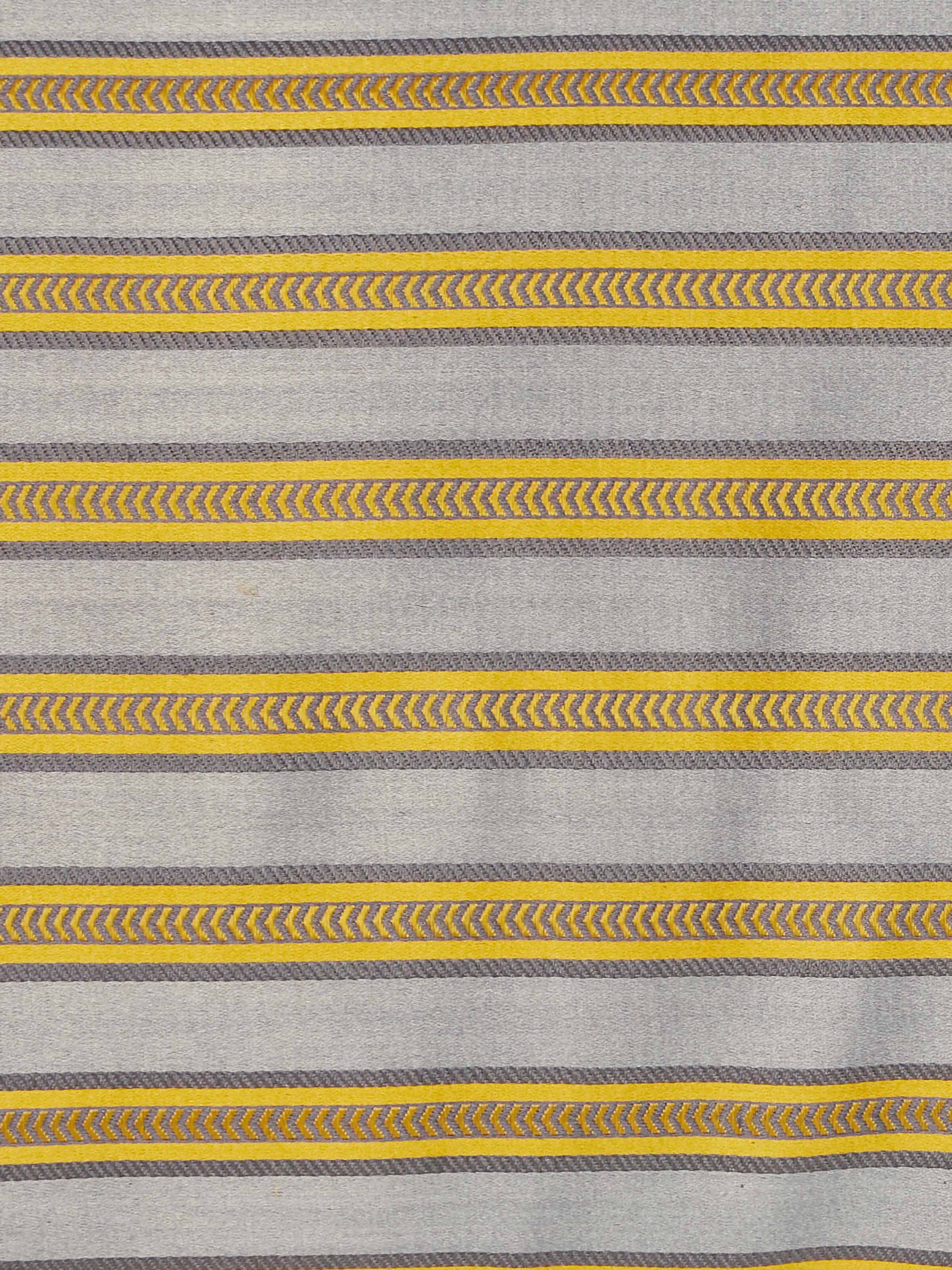 Aruni grey stripe silk mashru Banarasi handloom lumbar cushion cover displayed in a setting, emphasizing its design and use.