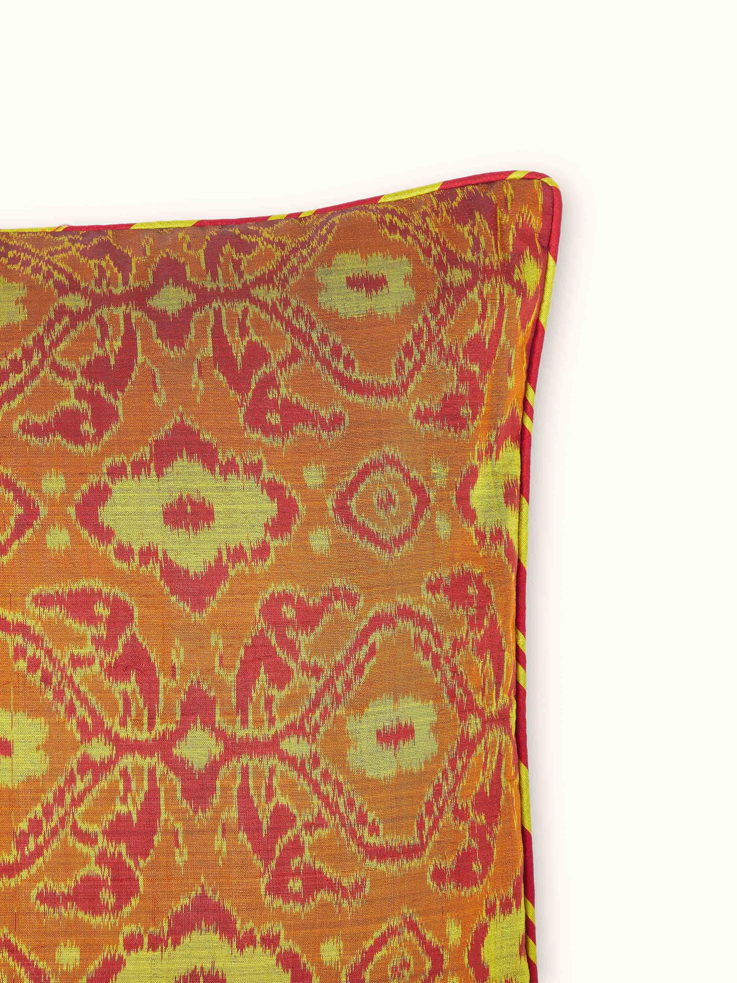 Detailed view of Bhoomi red allover silk Odisha handloom ikat cushion cover focusing on the fabric texture and intricate ikat design
