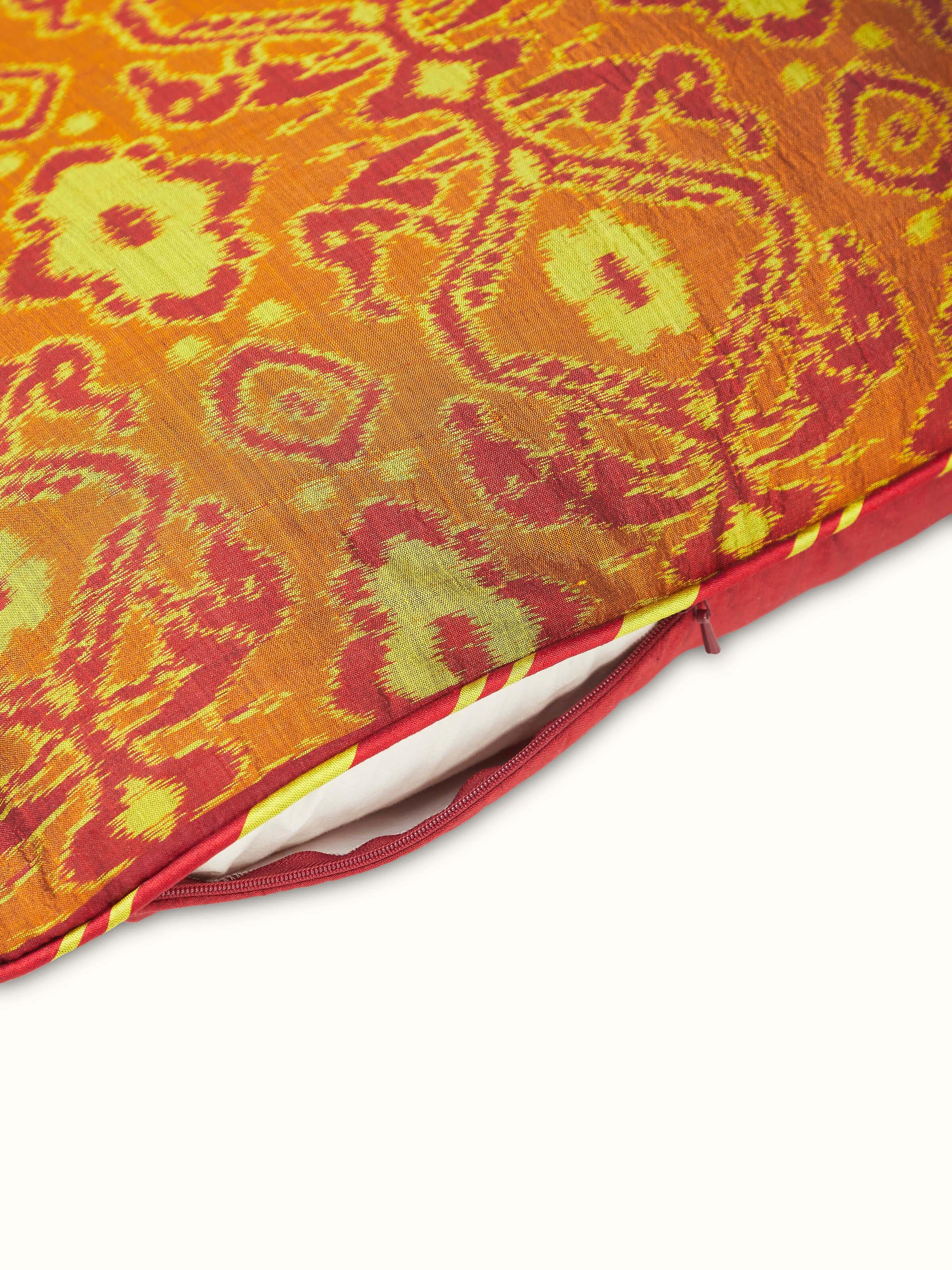 Full view of Bhoomi red allover silk Odisha handloom ikat cushion cover displaying its rich red color and traditional ikat design