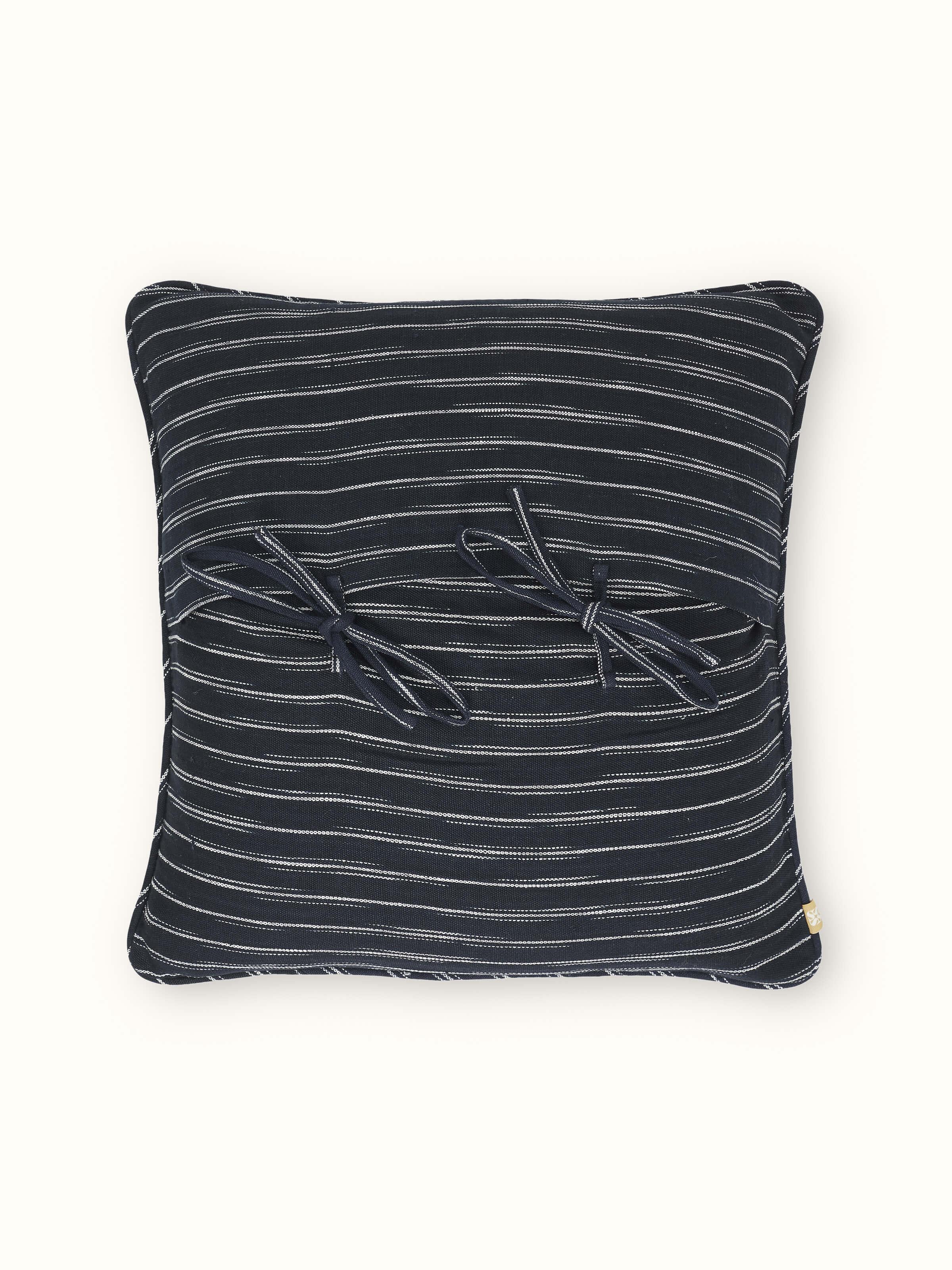 Close-up of Krsna black Utpala cotton handloom cushion cover emphasizing the texture and durability of the fabric