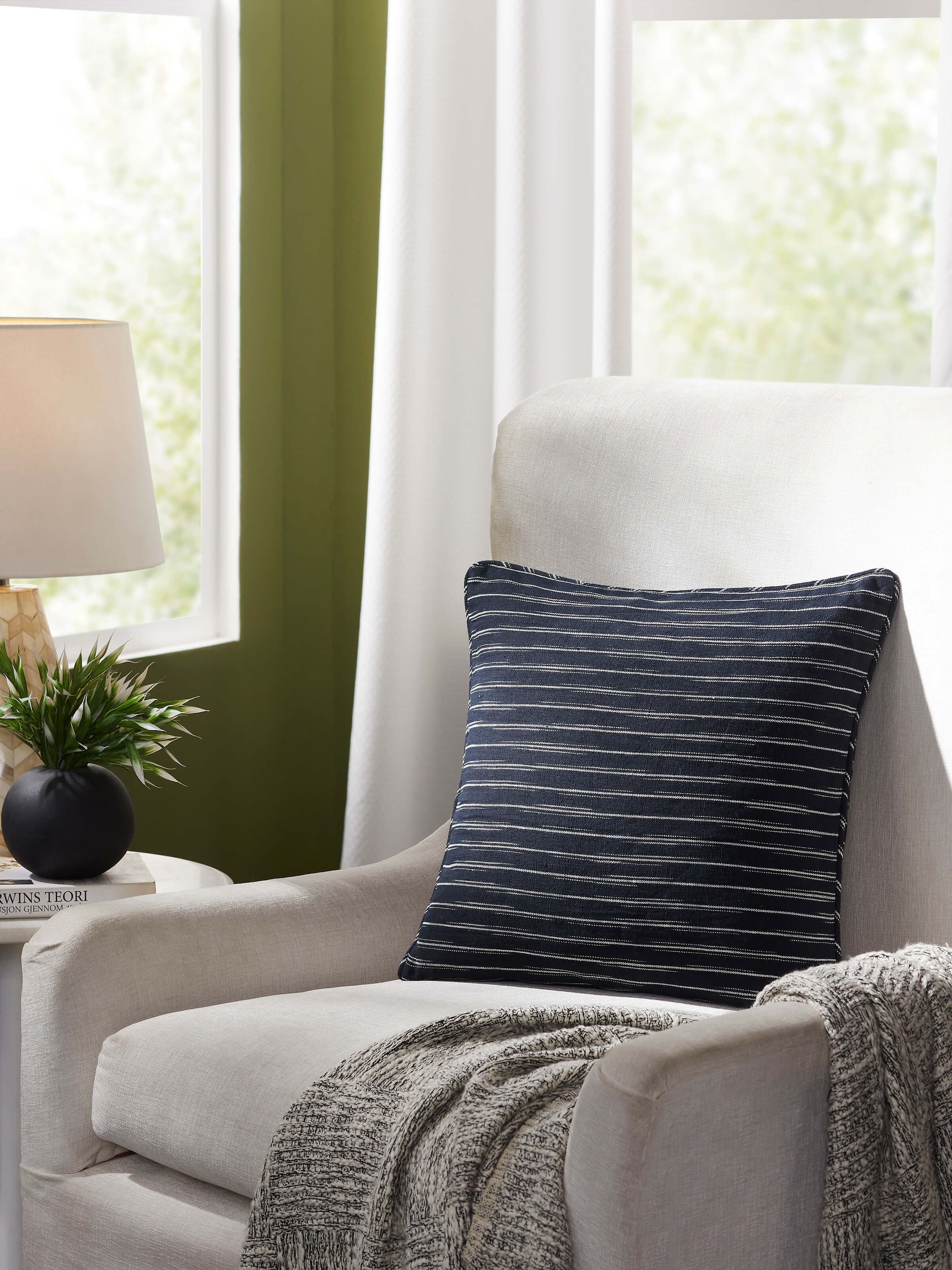 Close-up of Krsna black Mridul cotton handloom cushion cover