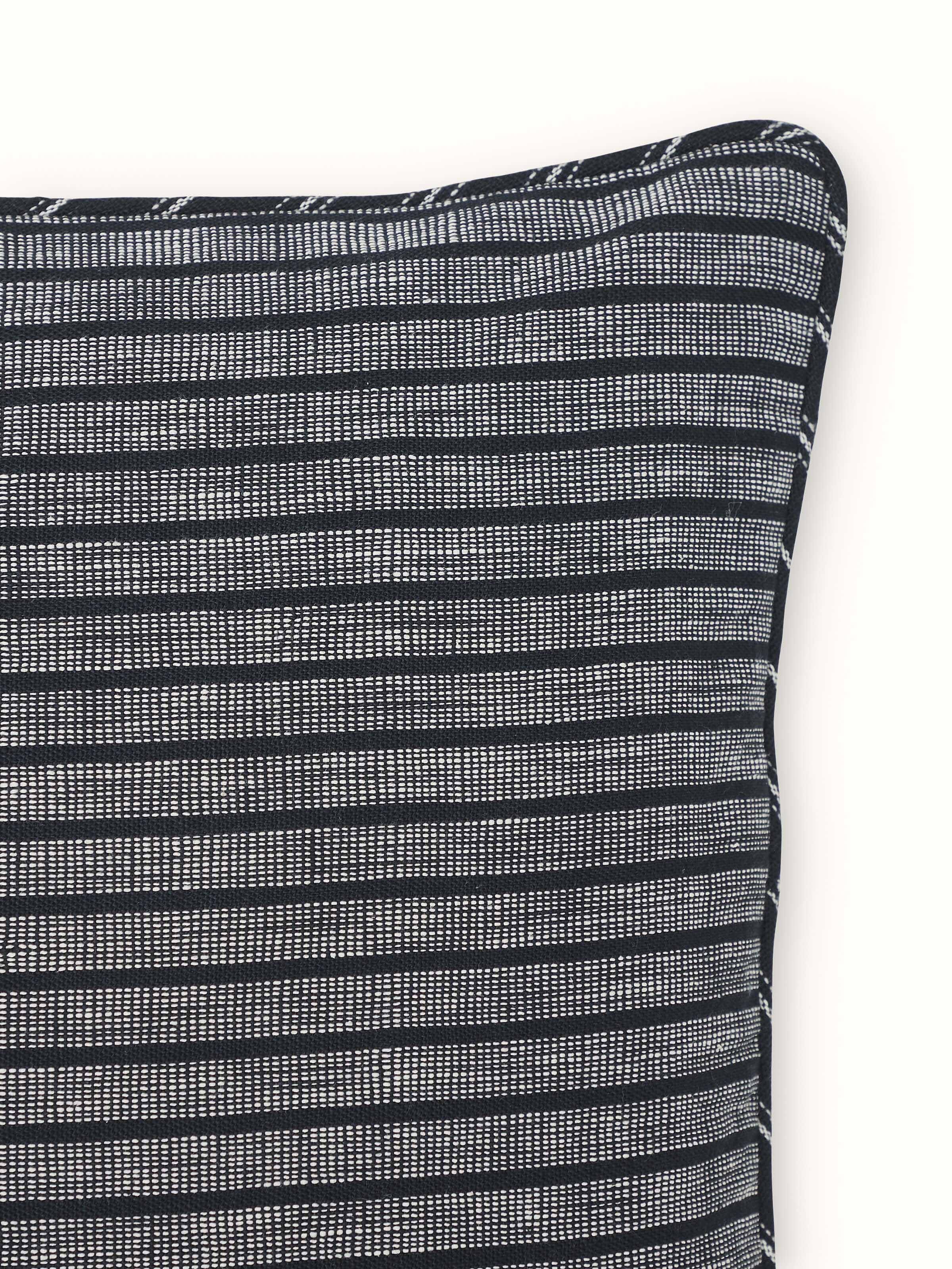 Detailed view of Krsna black rekh cotton handloom cushion cover, showcasing the handloom craftsmanship and black color.