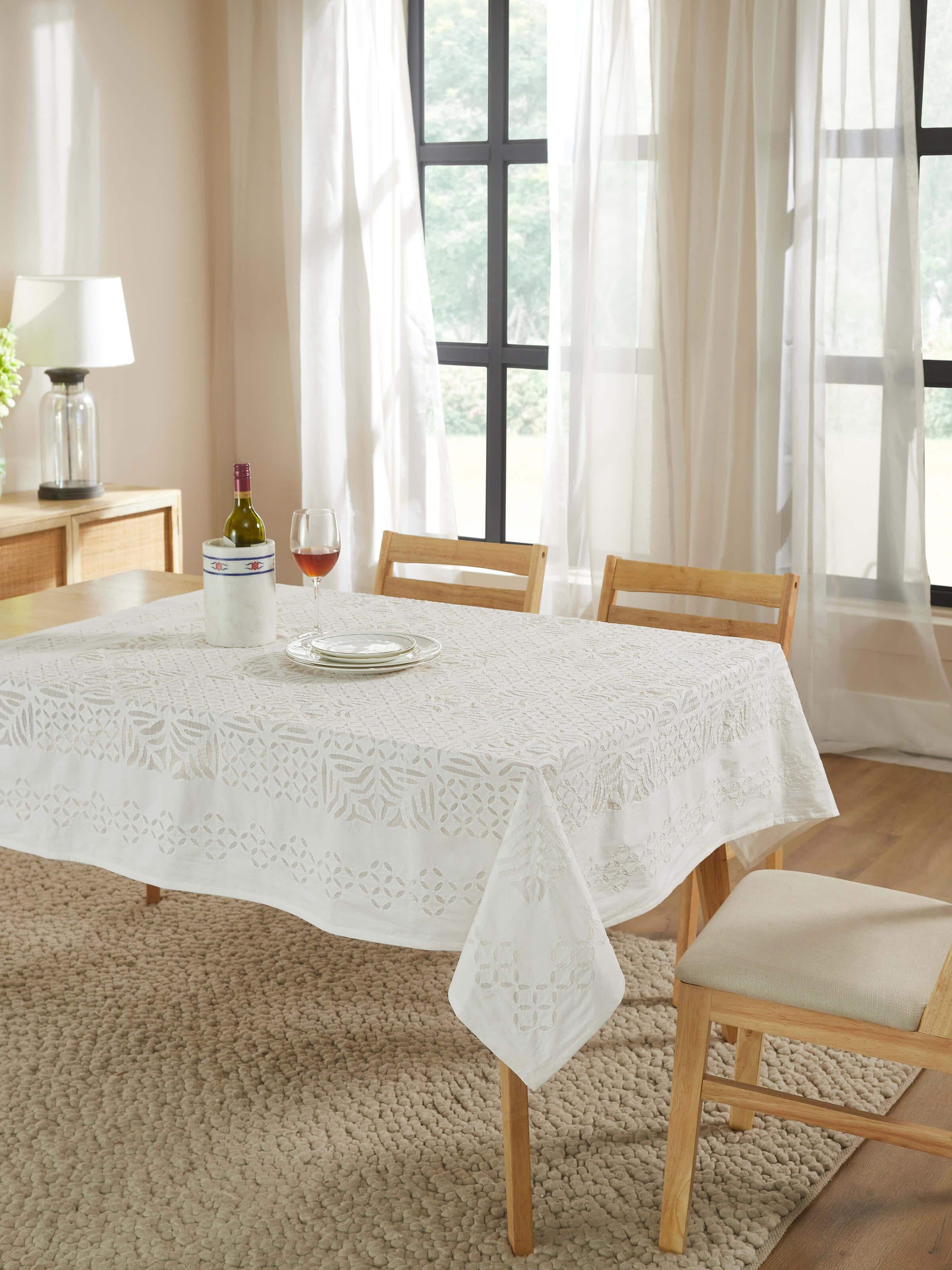 Close-up of Ekam white trellis cotton appliqué embroidered table cover (4 seater) emphasizing the intricate appliqué embroidery details.