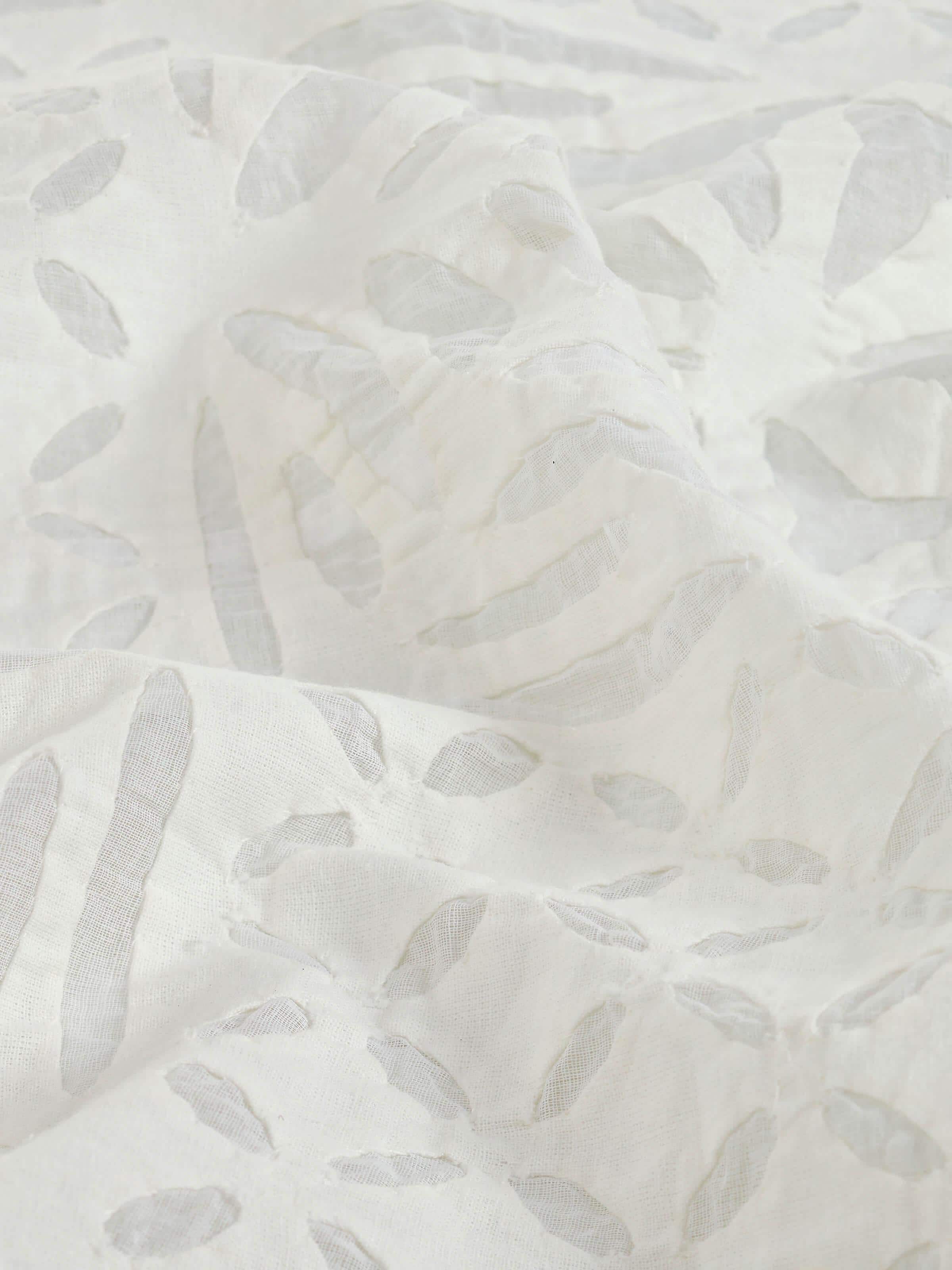 Detailed view of Ekam white trellis cotton appliqué embroidered table cover (4 seater) highlighting the fine embroidery and texture.