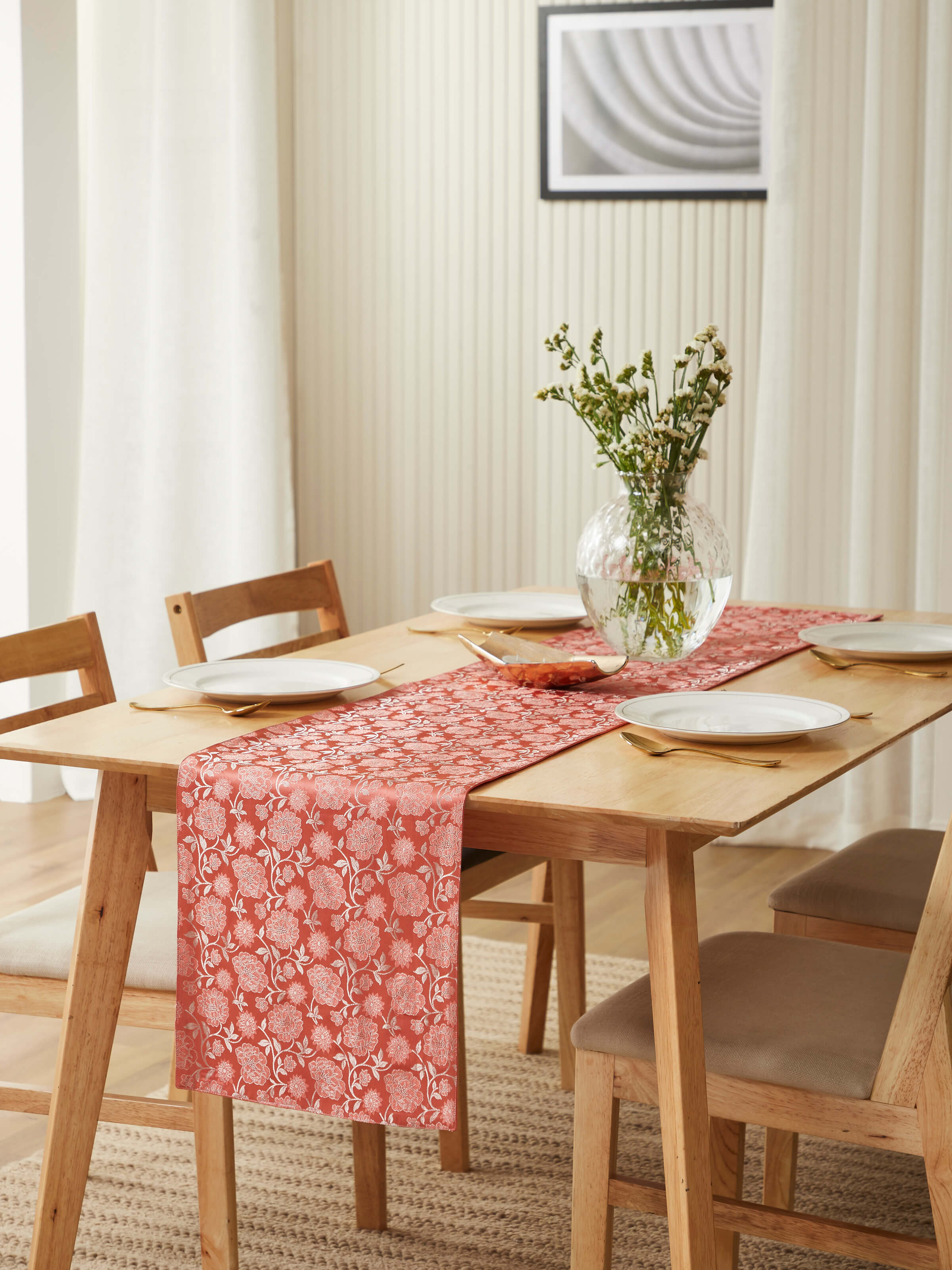 Lifestyle image featuring the peach Banarasi runner styled on a table for festive or elegant dining decor.