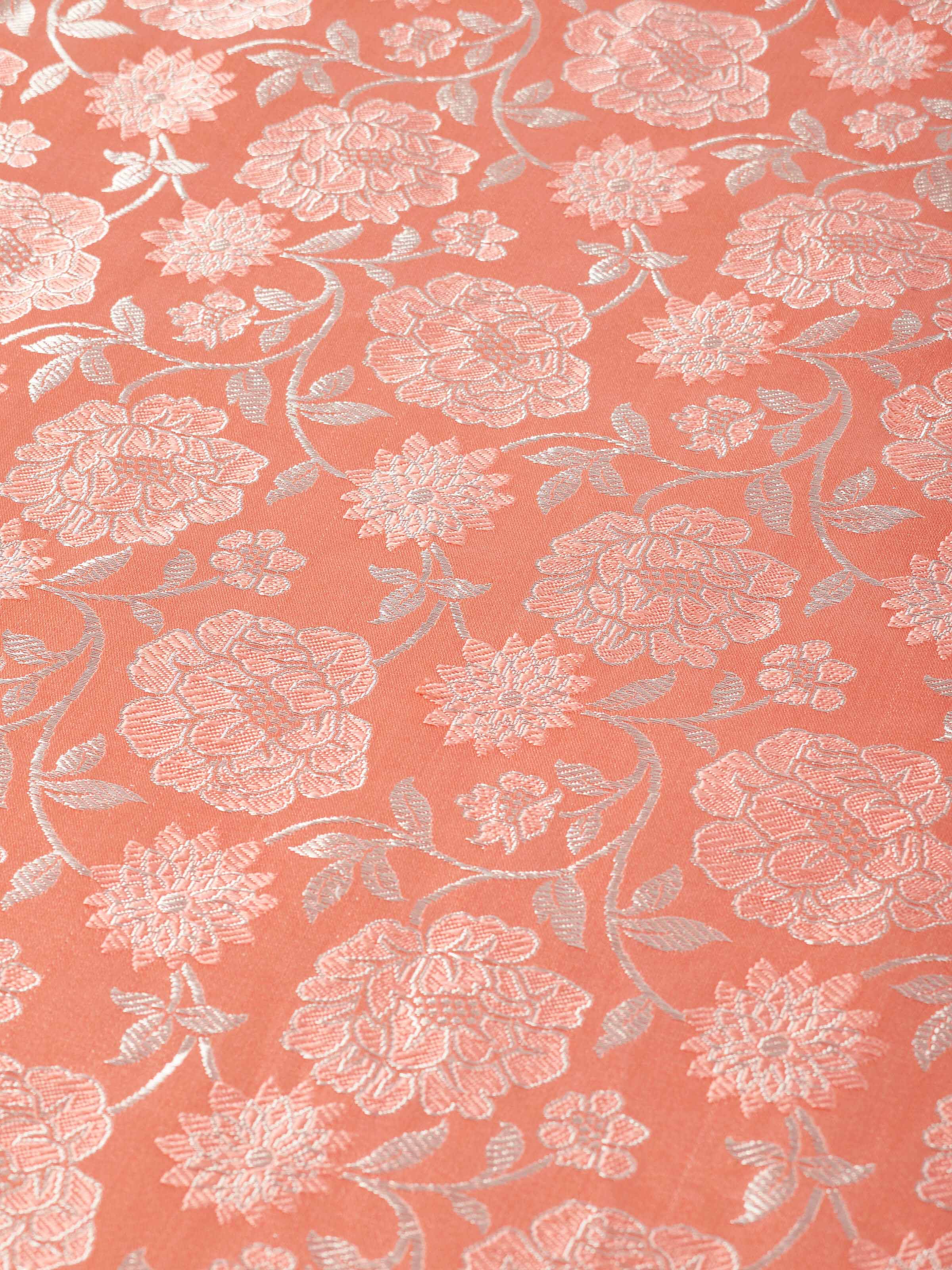 Close-up image showing opulent jaal pattern and shimmer of handwoven silk.