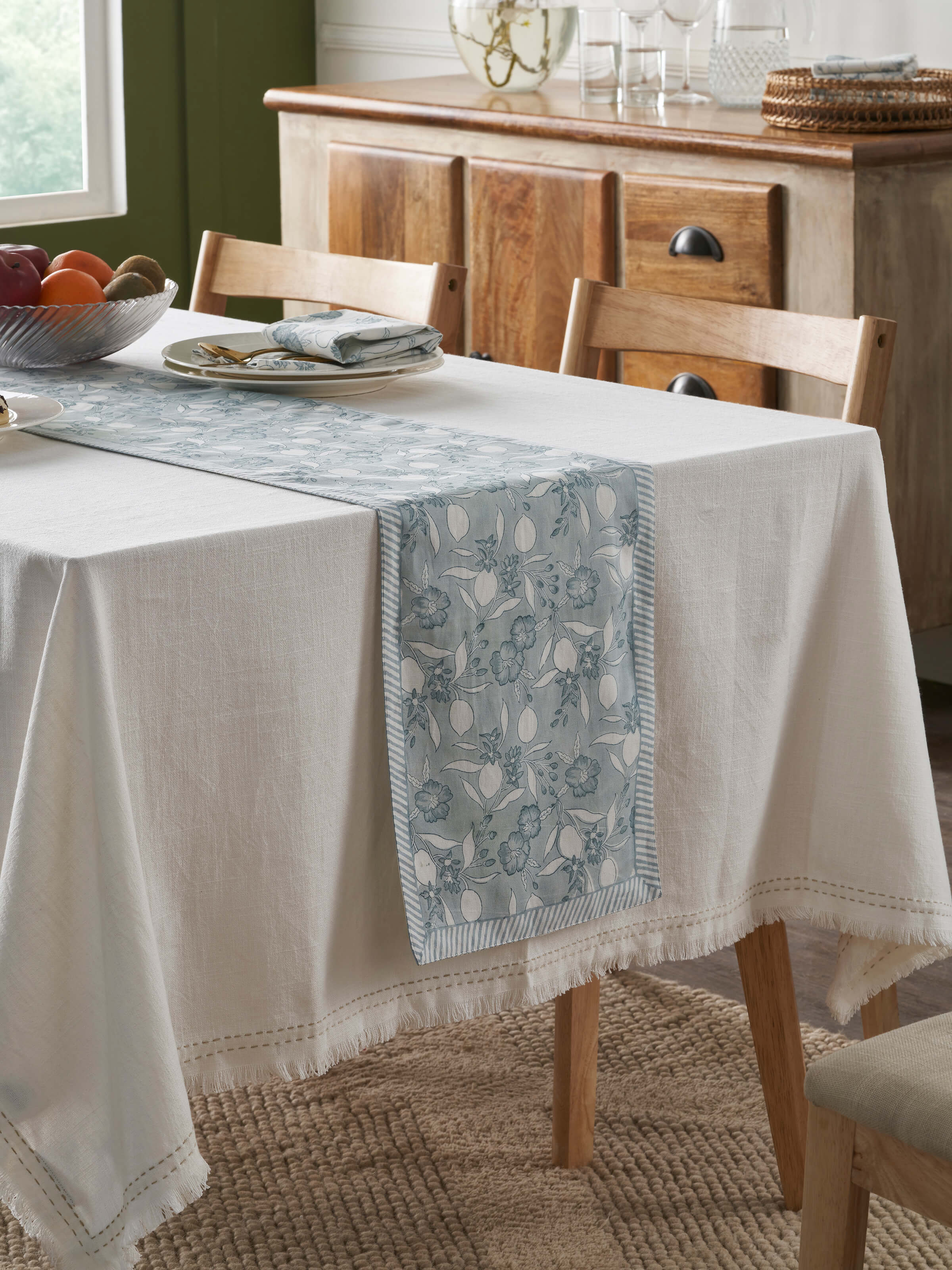 Side view of Anika light blue floral cotton linen Sanganeri block printed table runner (6 seater) showcasing the elegant design