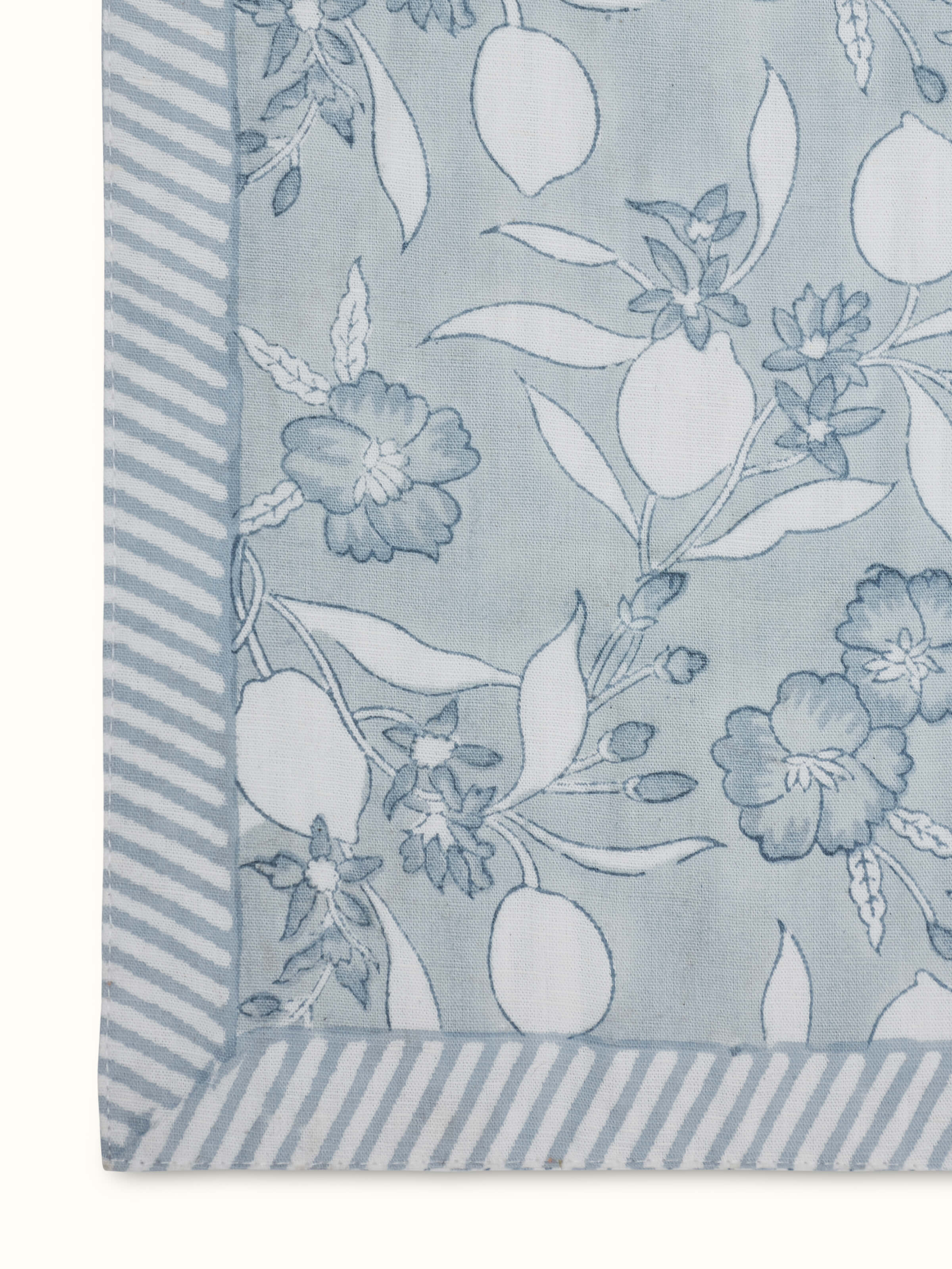 Detailed shot of Anika light blue floral cotton linen Sanganeri block printed table runner (6 seater) highlighting the fine pattern