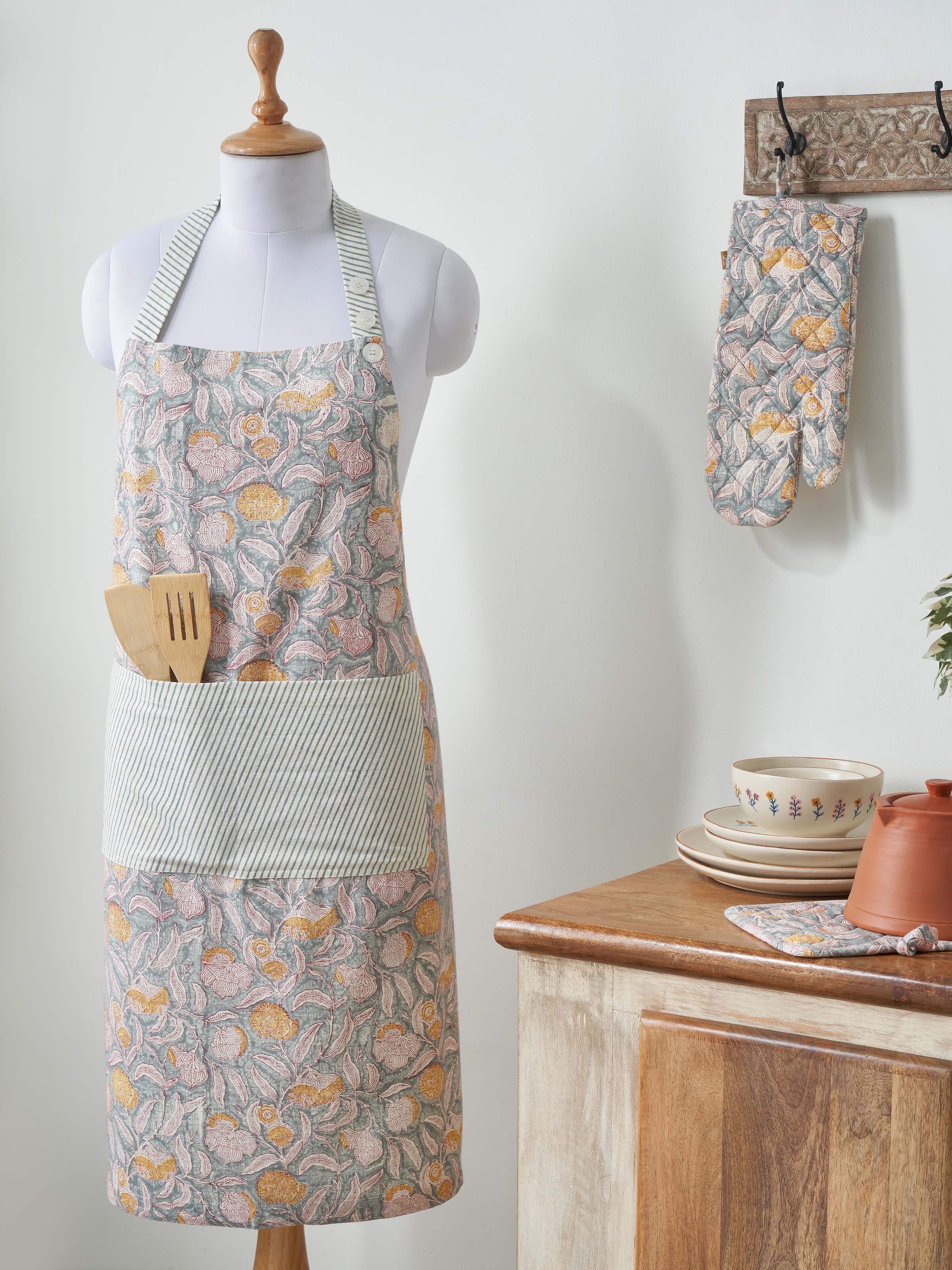 Side view of grey floral cotton Sanganeri block printed apron highlighting the apron’s design and block print details.