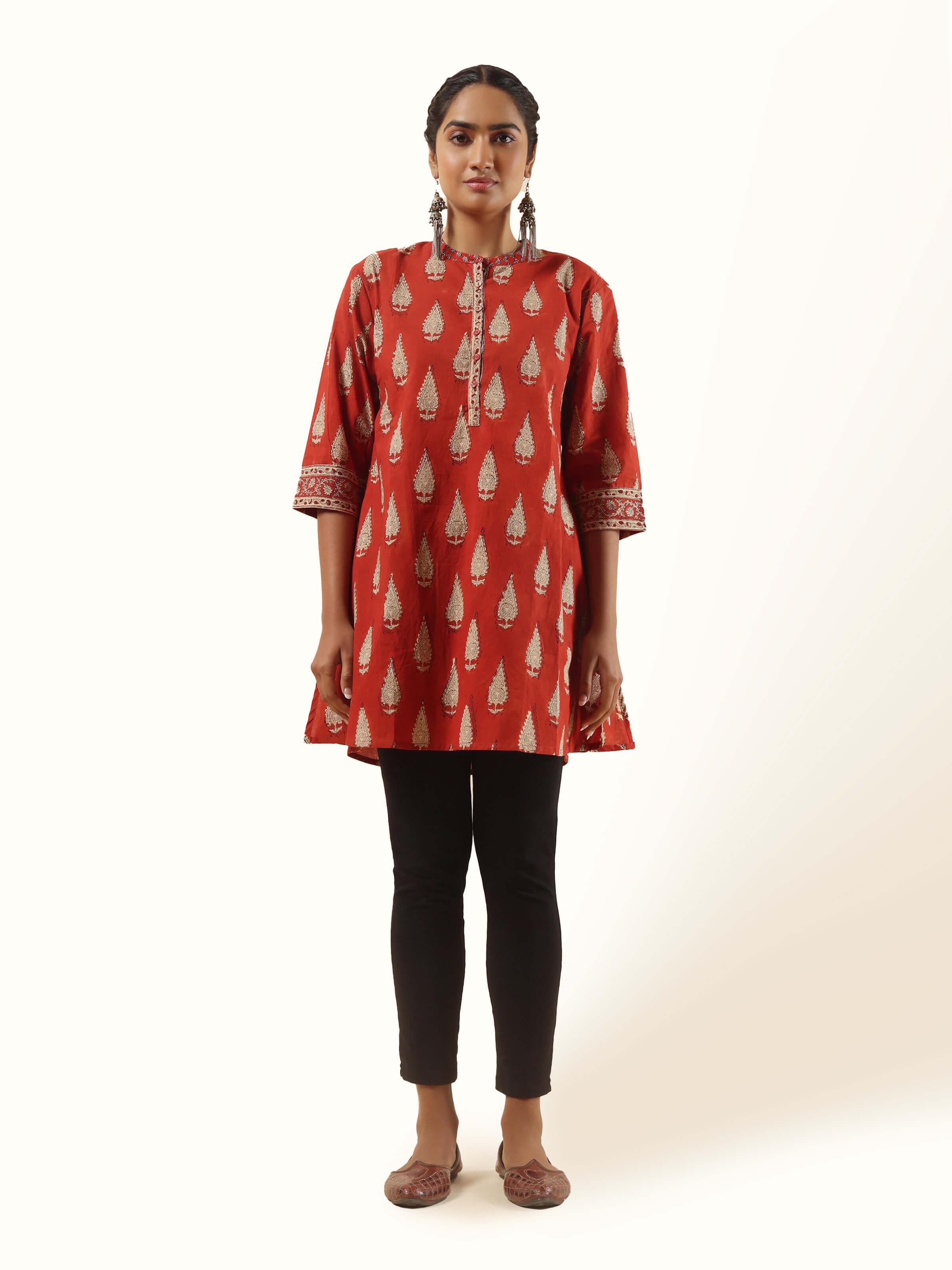 Front view of red Bagru block printed cotton tunic with V-neck and pleated front.