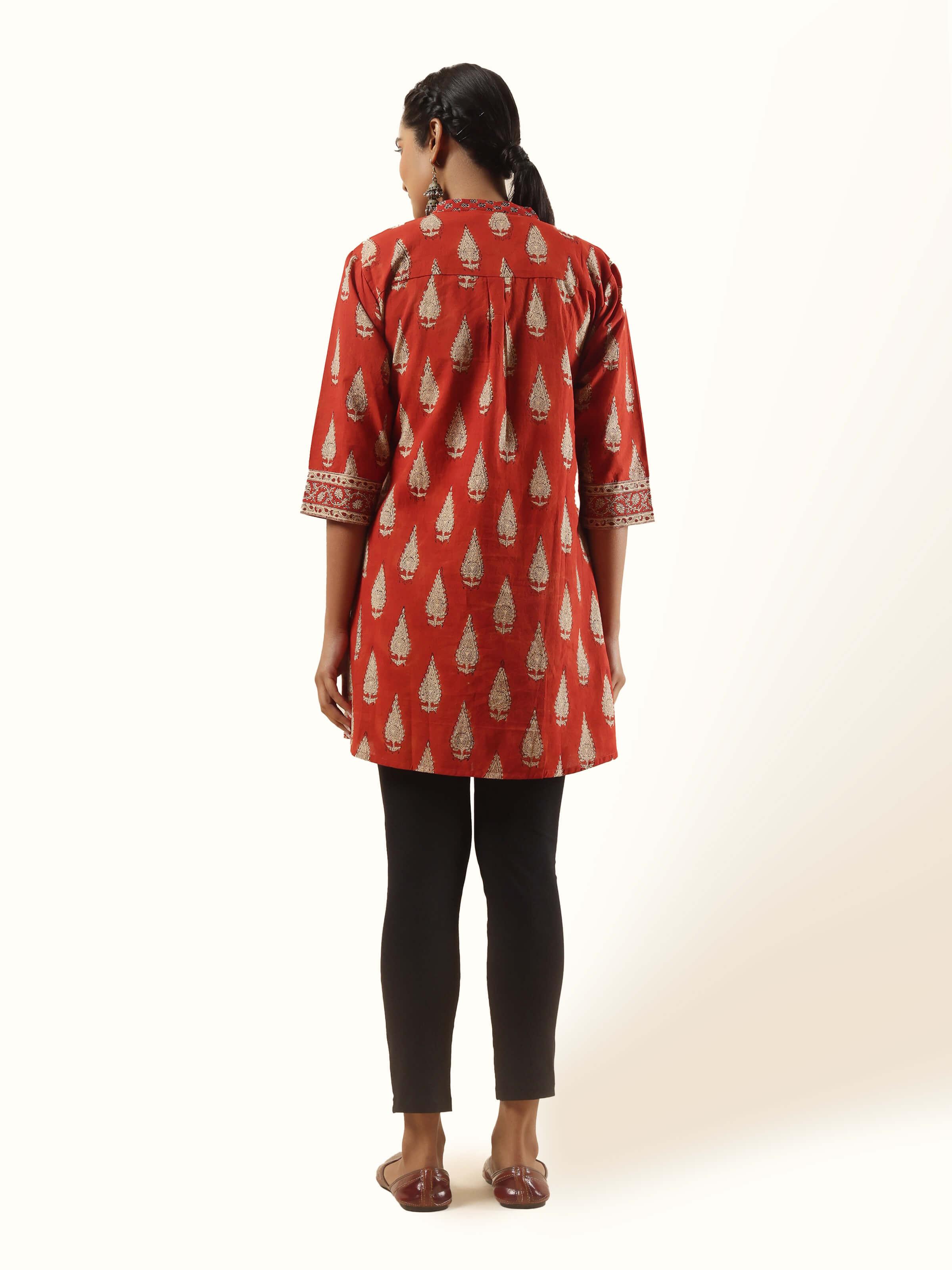 Back view of tunic with all-over block print and gathered yoke.