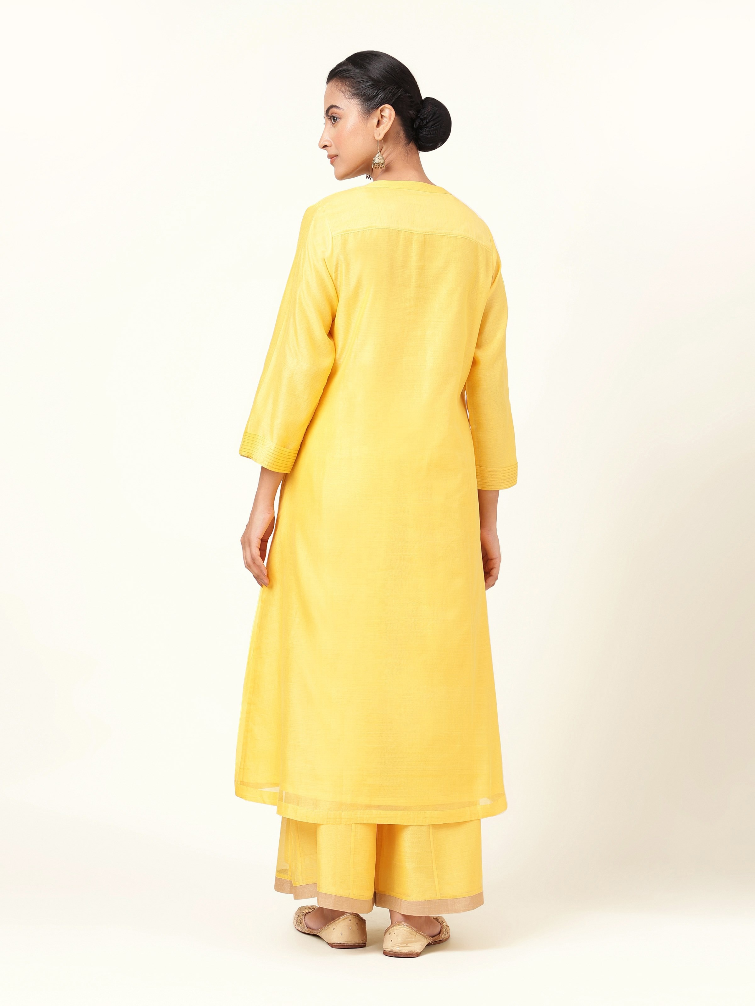 Back view of yellow cotton silk kurta showing clean finish and straight cut design