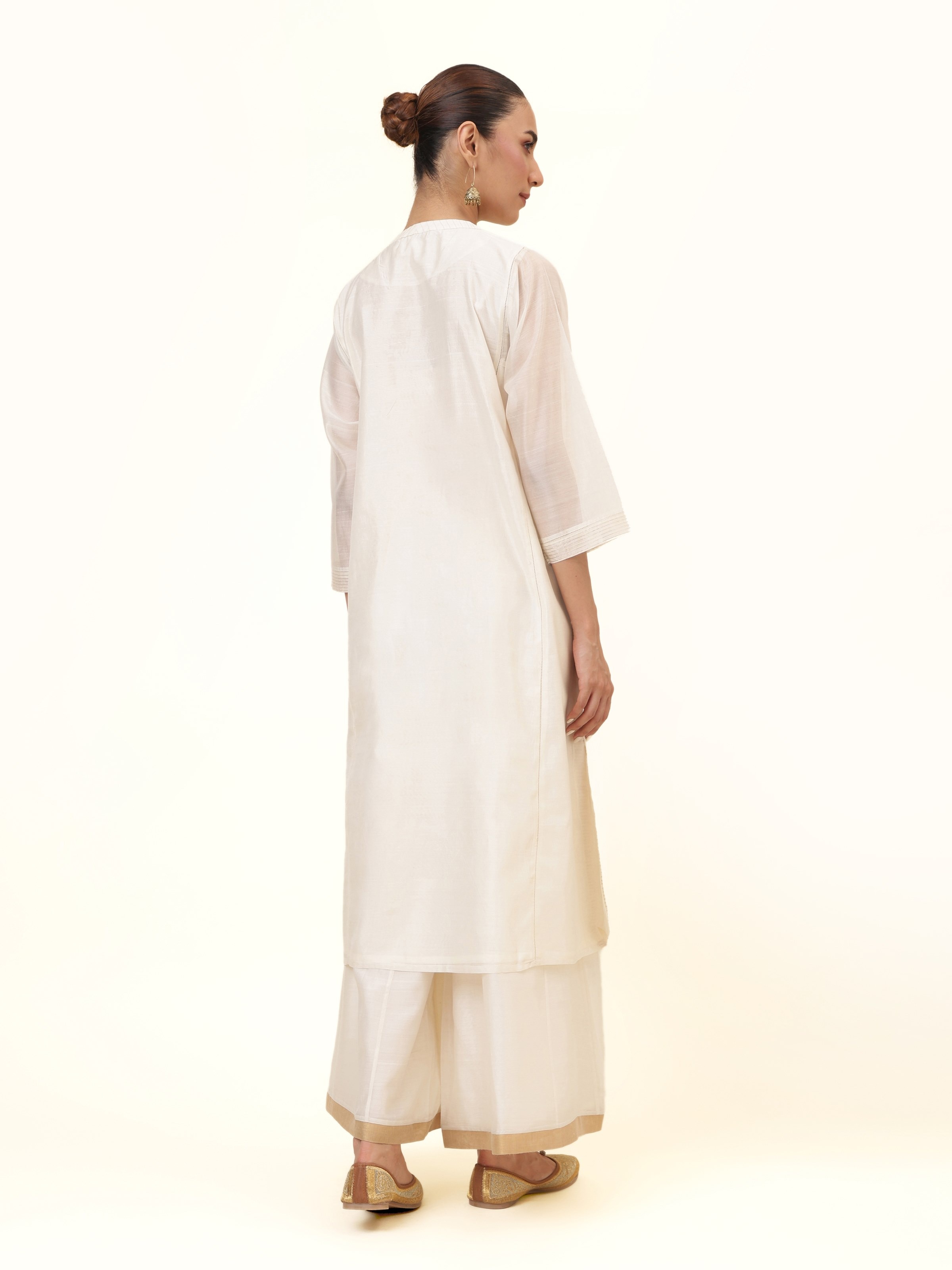 Back view showing the soft drape and graceful finish.