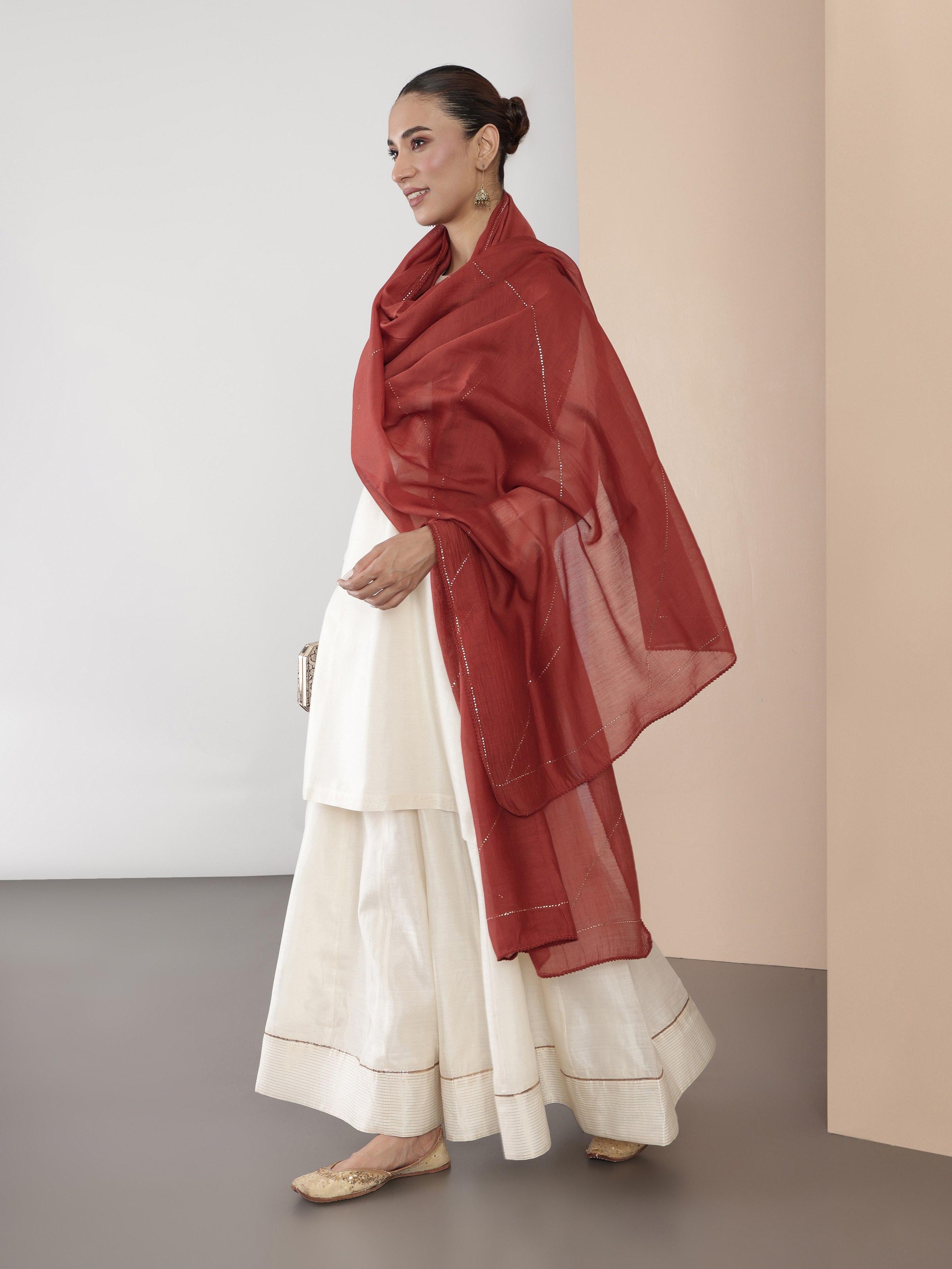 Alternate angle highlighting the soft pleats and sophisticated movement of the skirt.