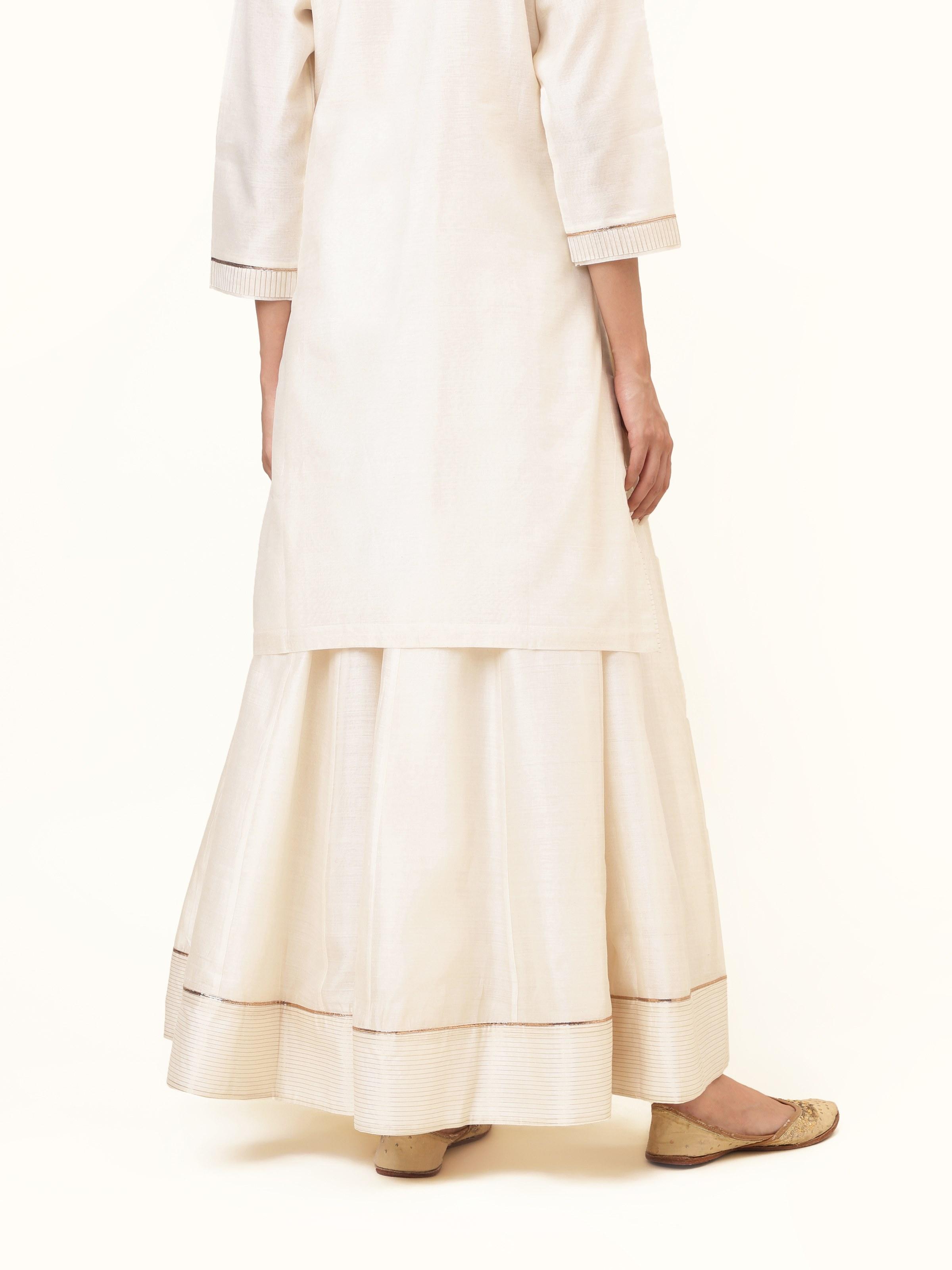 Back view offering a complete glimpse of the skirt’s classic charm and refined simplicity.