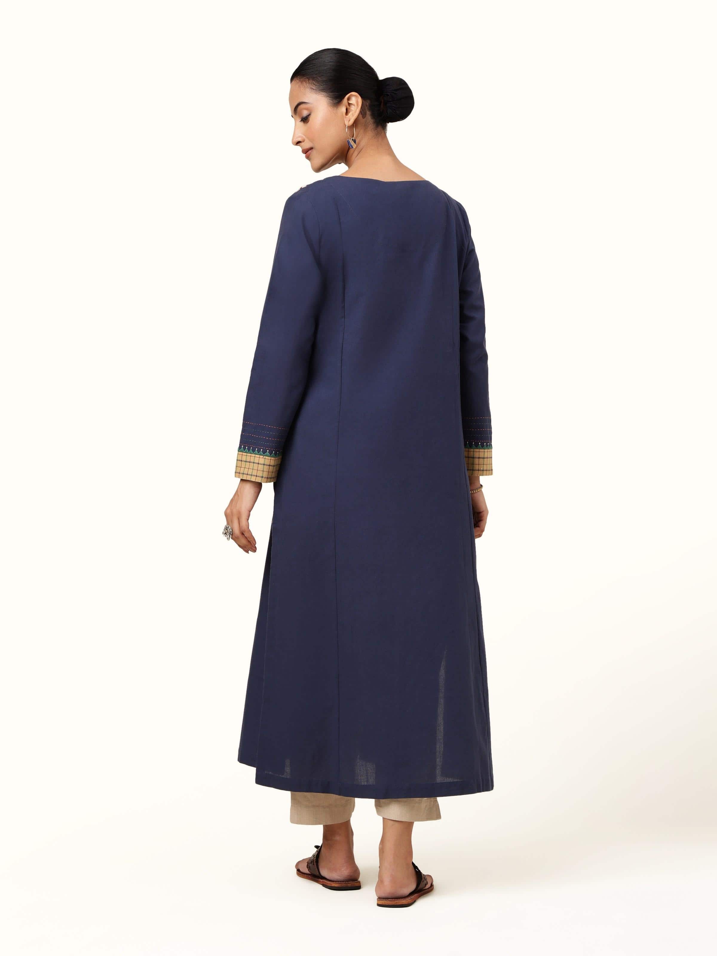 Back view of blue kurta highlighting straight cut and embroidered sleeve detailing.