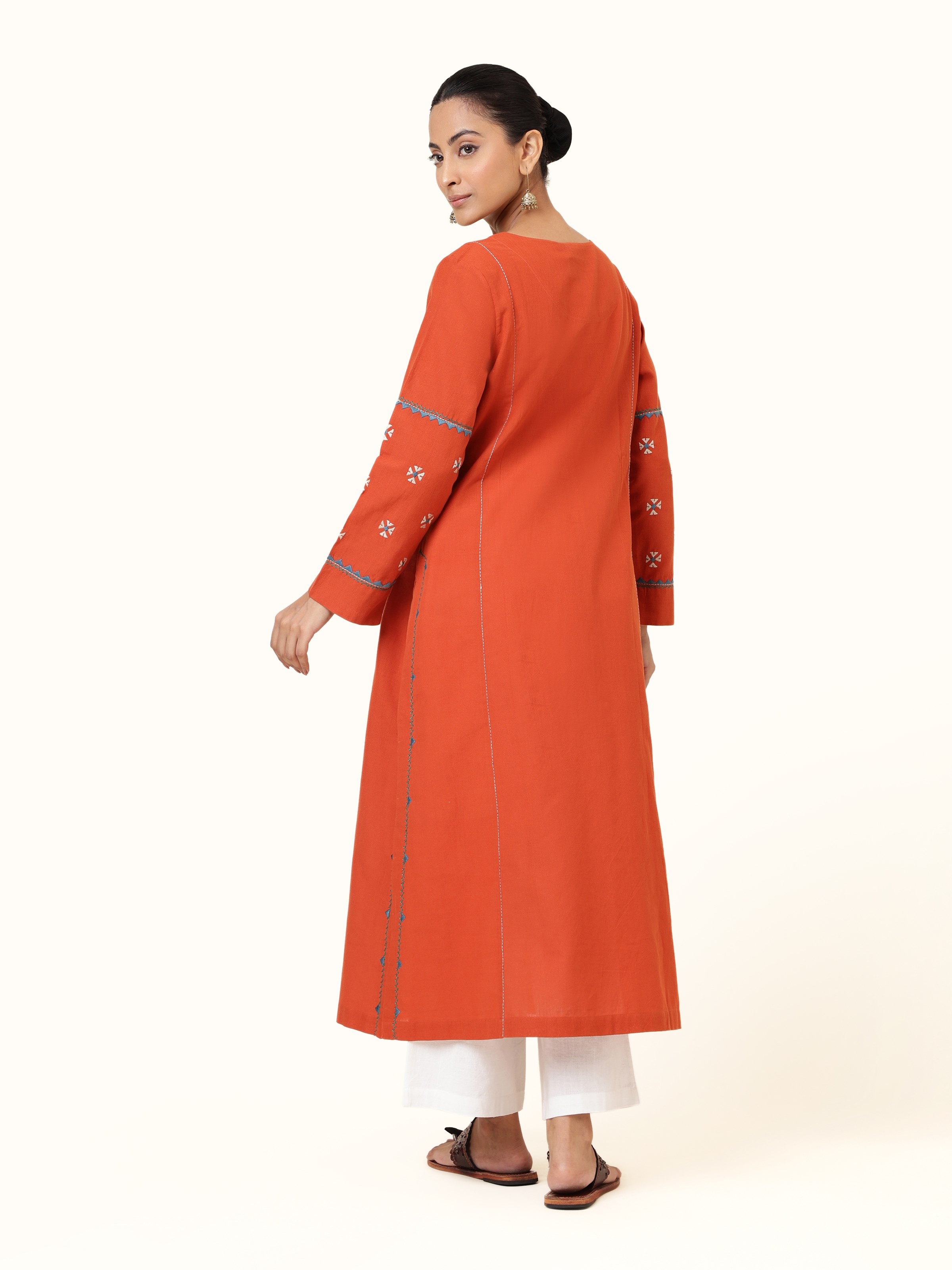 Back view of Rust Cotton Rajasthani Embroidered Kurta showing embroidery continuation and kurta silhouette.