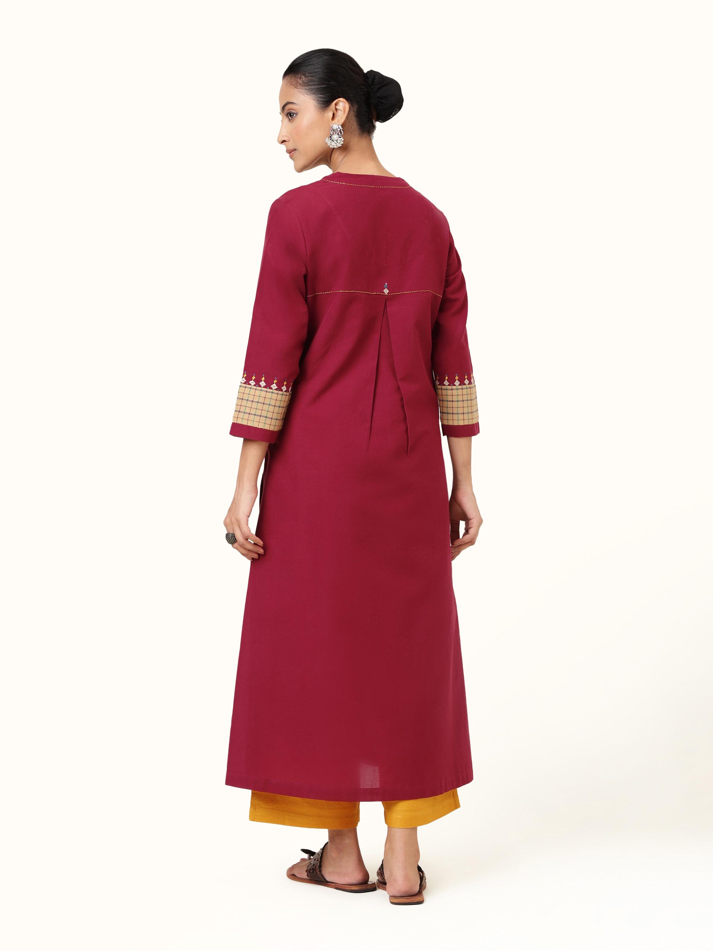 Back view of maroon cotton Rajasthani embroidered kurta showing yoke and embroidery pattern.