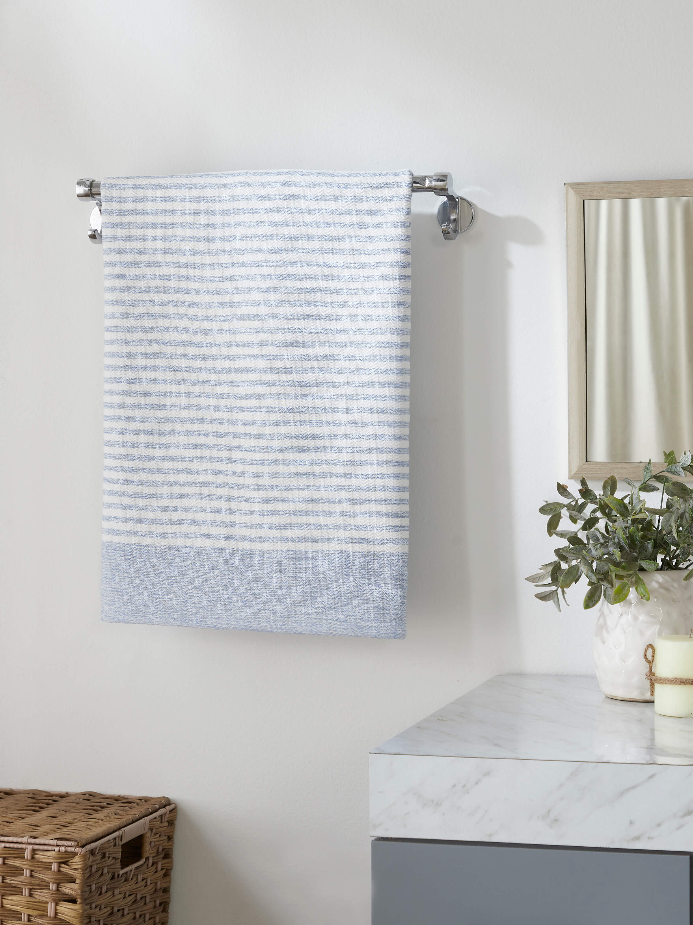 Detailed view of Vayana stripe blue cotton bath towel (L) highlighting the stripe pattern and high-quality cotton fabric.