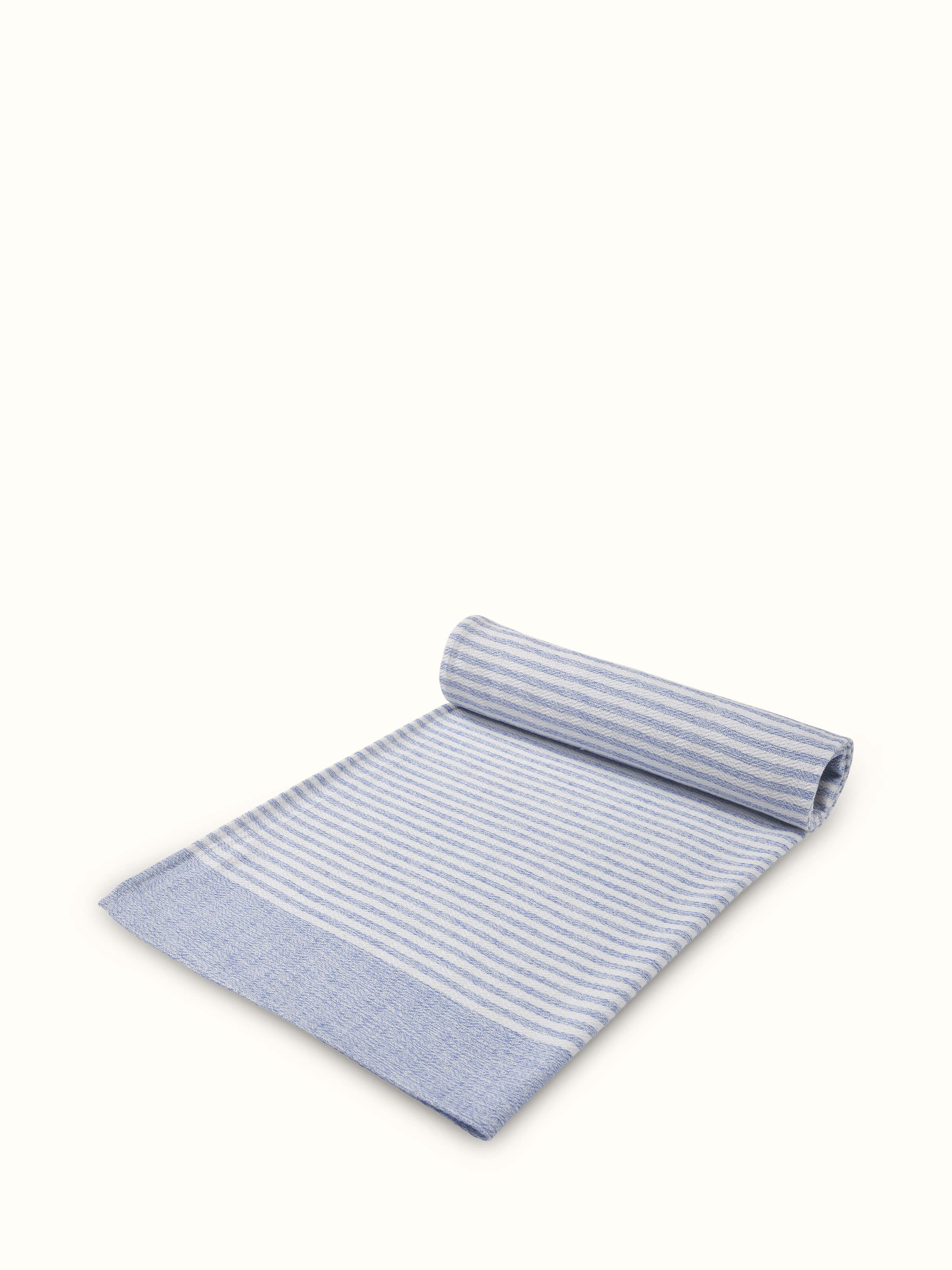 Close-up of Vayana stripe blue cotton bath towel (L) focusing on the cotton texture and stripe detail.