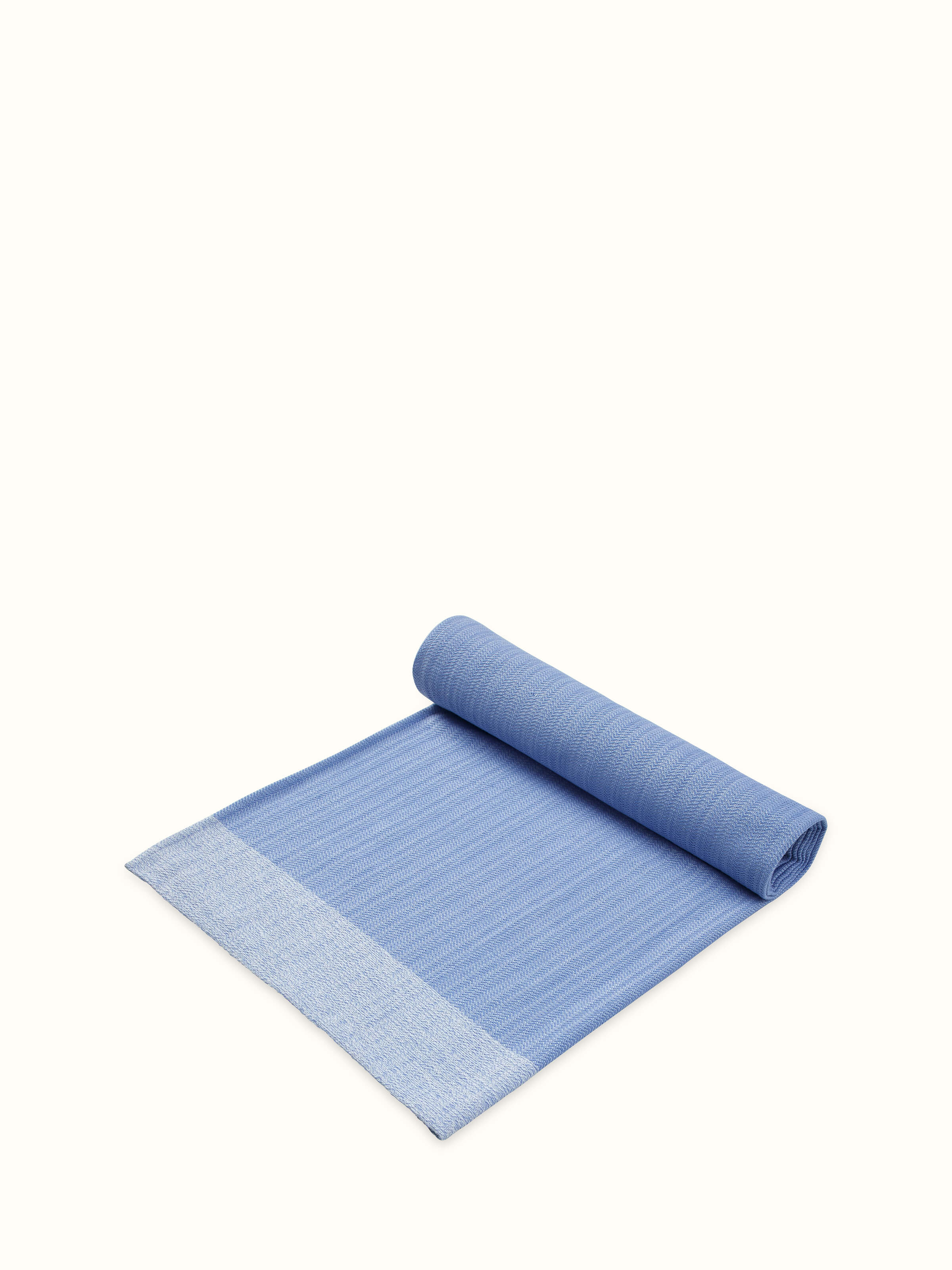 The Vayana solid blue stripe cotton bath towel (XL), showcasing the detailed stripe pattern and softness.