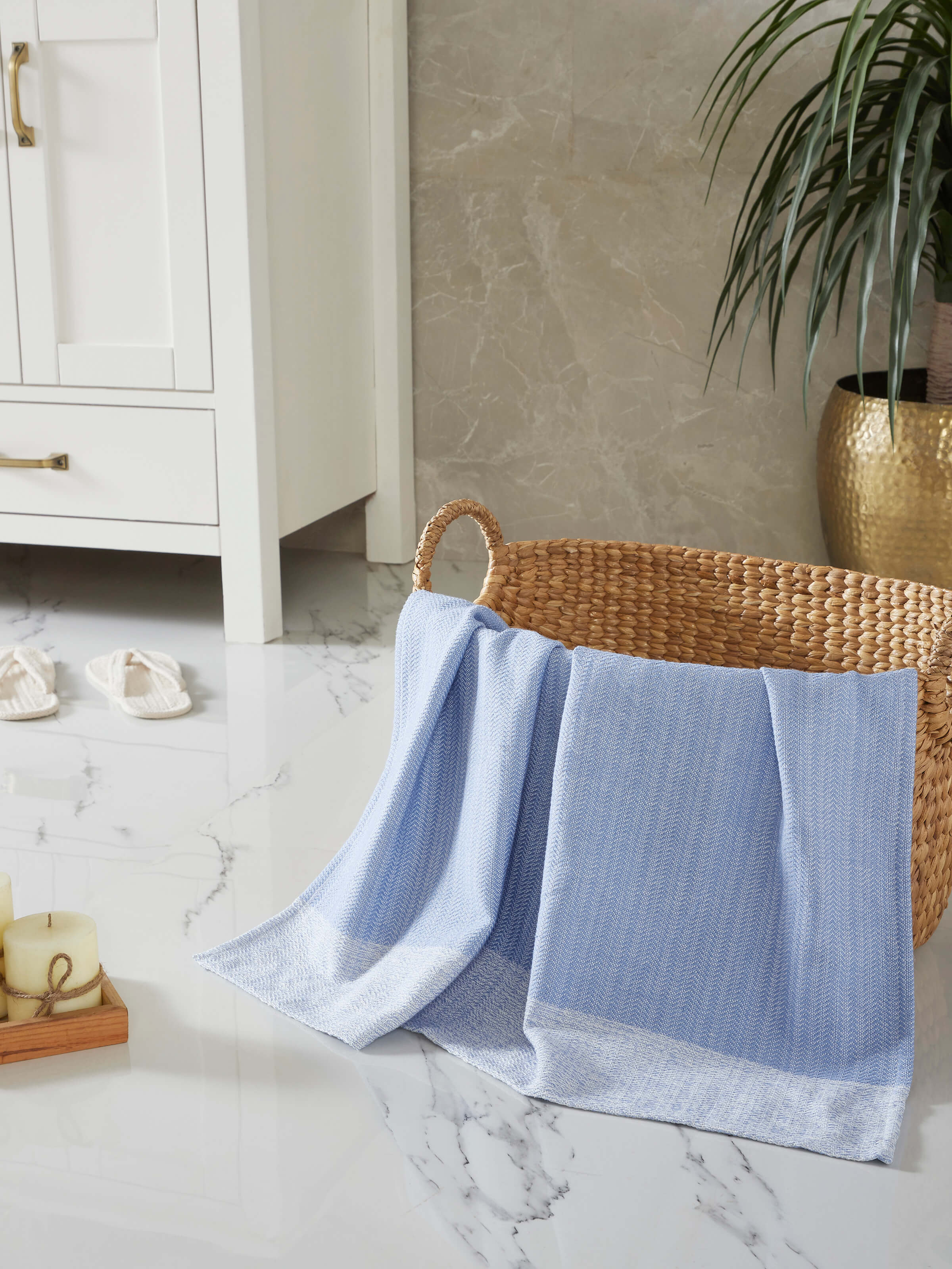Side view of Vayana Solid Blue Cotton Striped Bath Towel (L) emphasizing the thickness and color