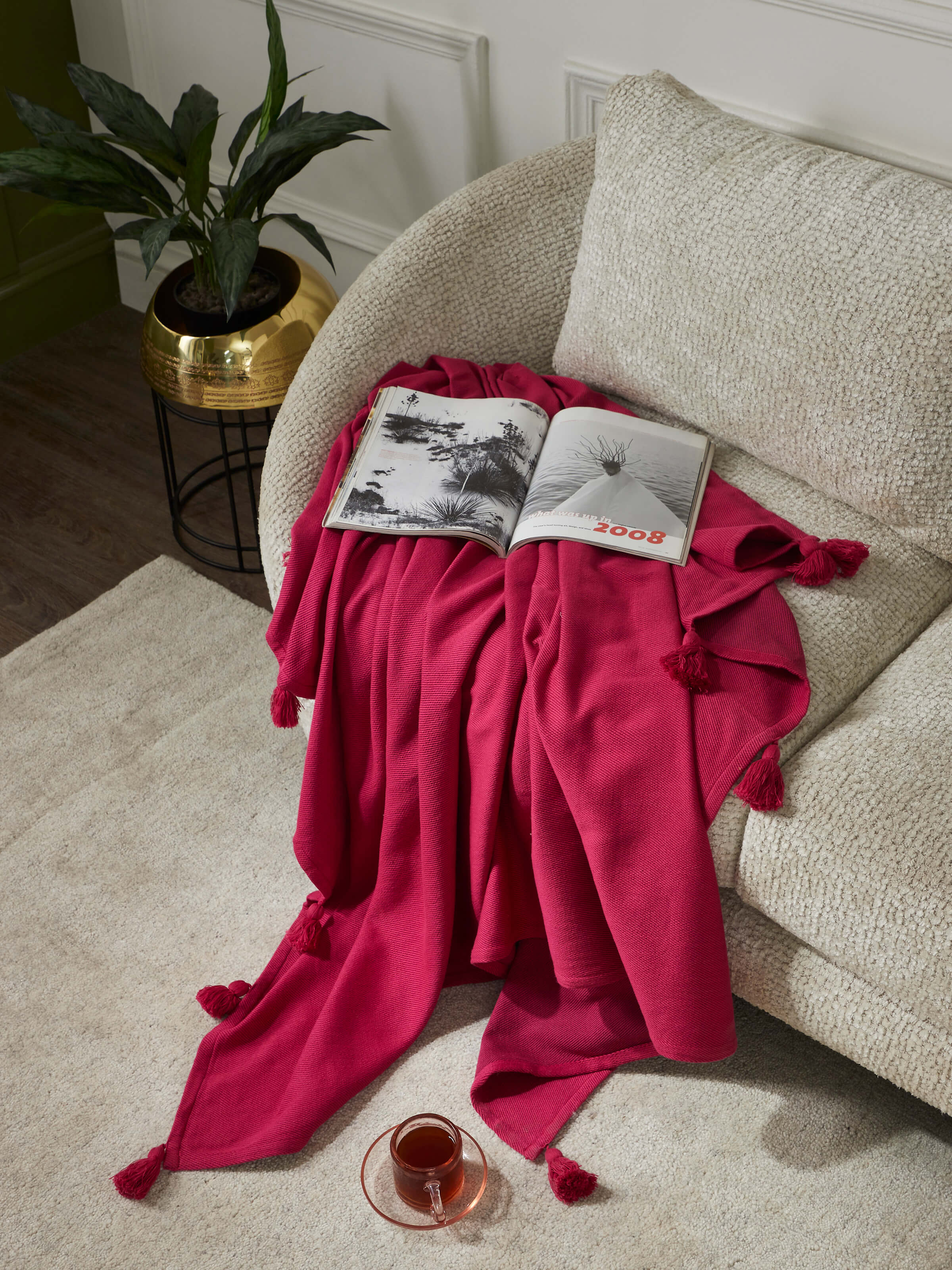 Close-up of Tavas Magenta cotton throw highlighting the handloom weave and vibrant color