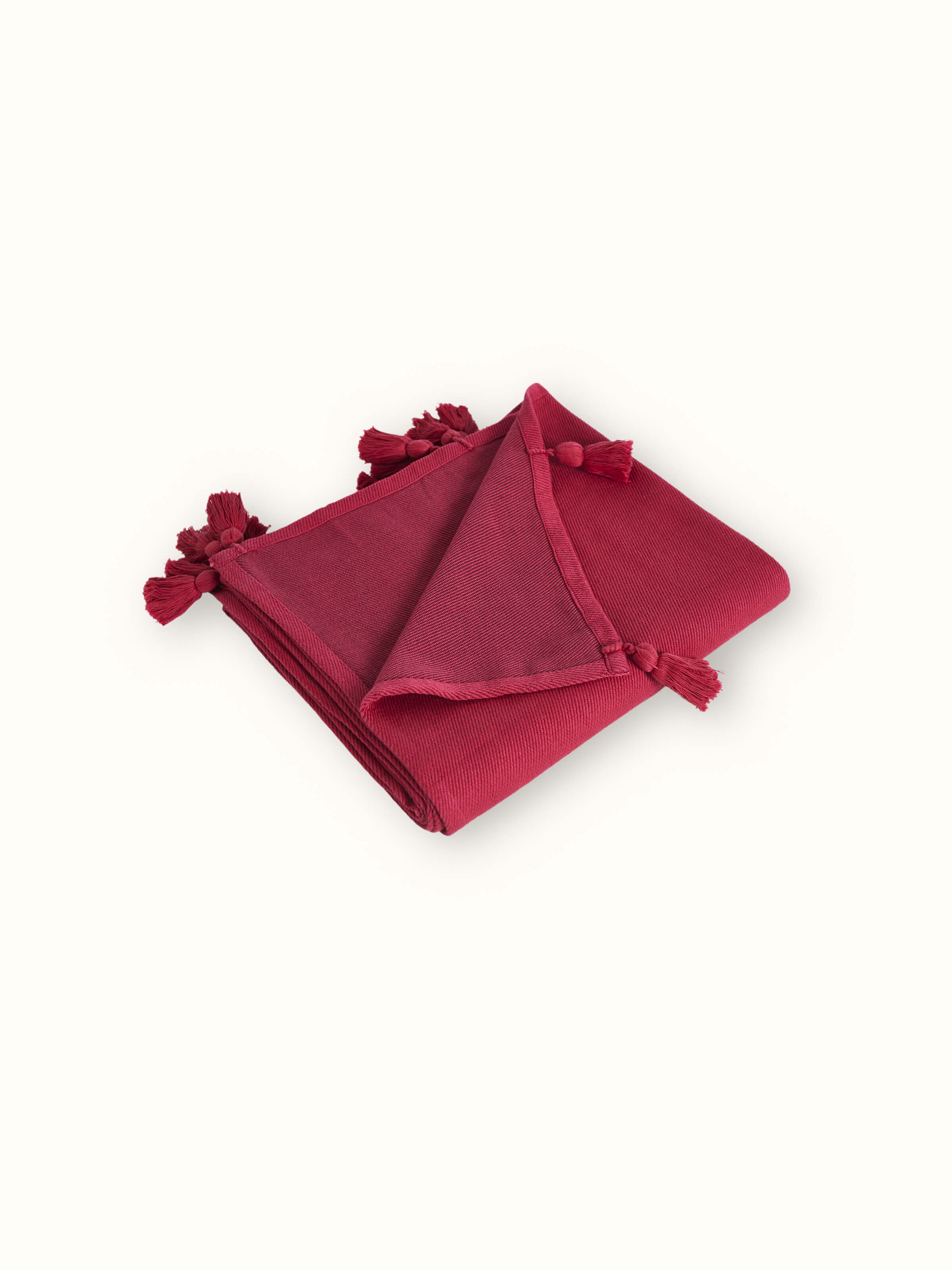 Detailed view of Tavas Magenta cotton throw's texture and weave, emphasizing its quality