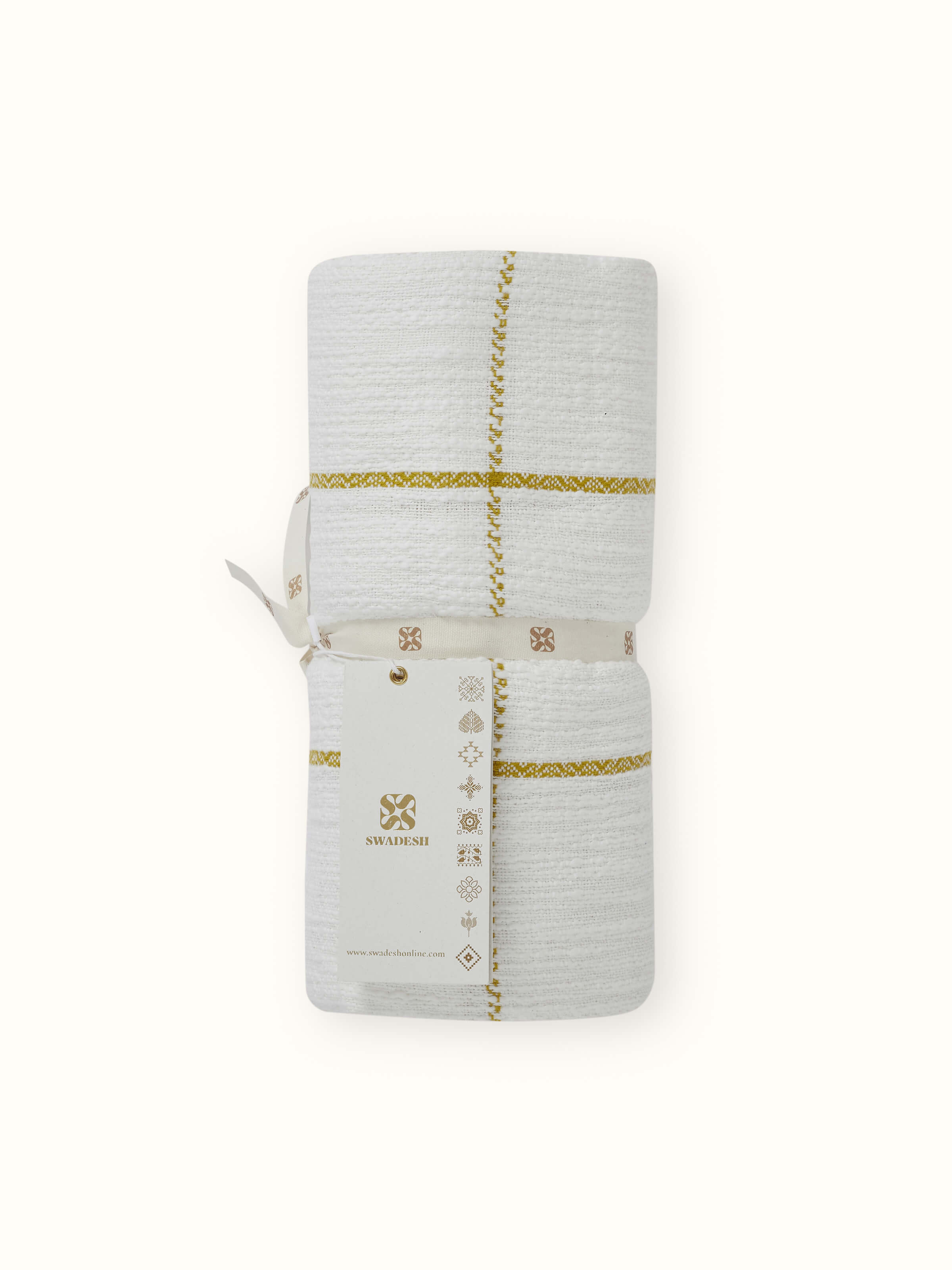 Close-up of Adhima Ochre Throw, highlighting the handloom twill pattern and soft cotton fabric.