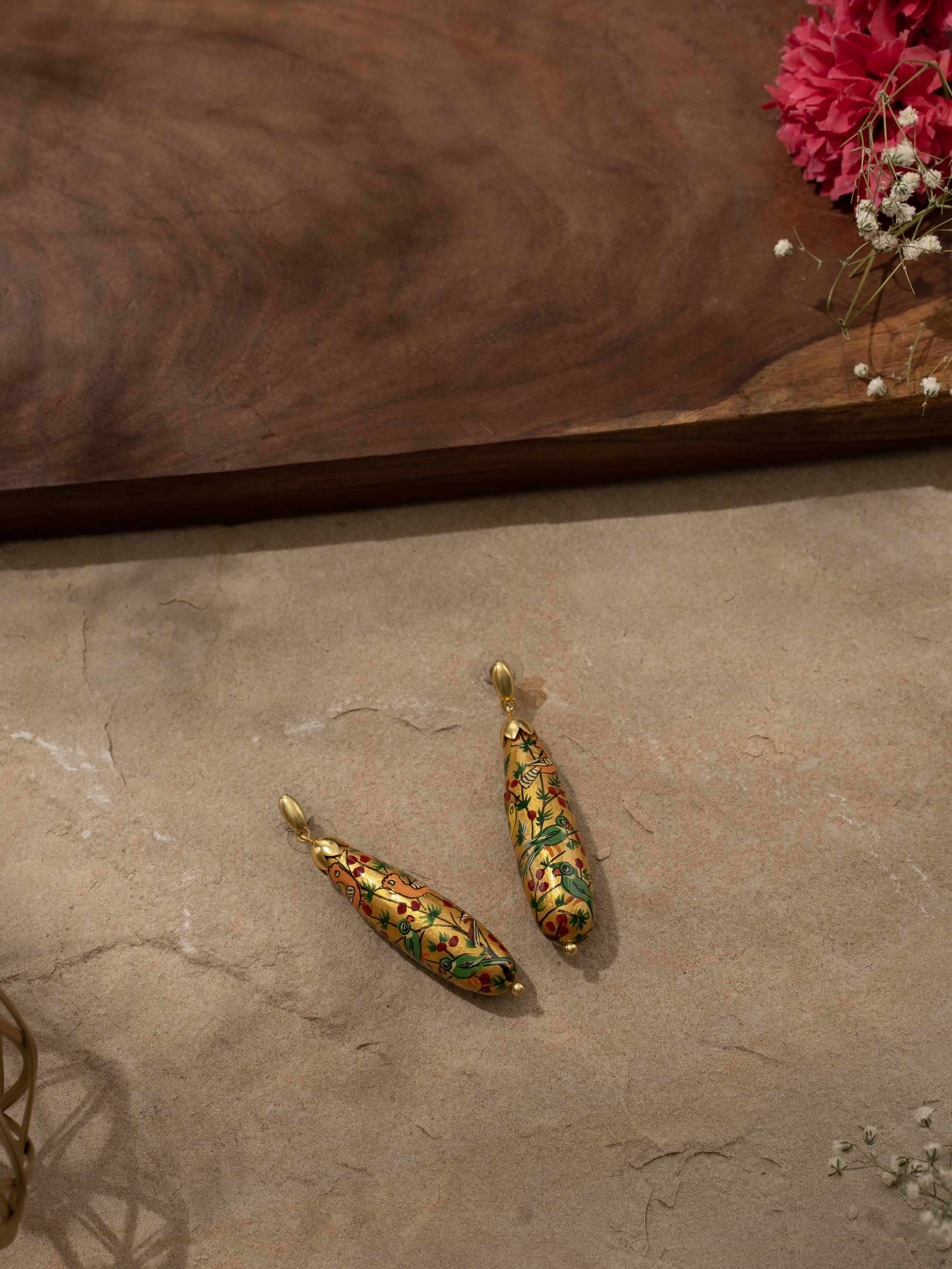 Close-up view of Papier-mâché Drop Earrings highlighting their intricate details.