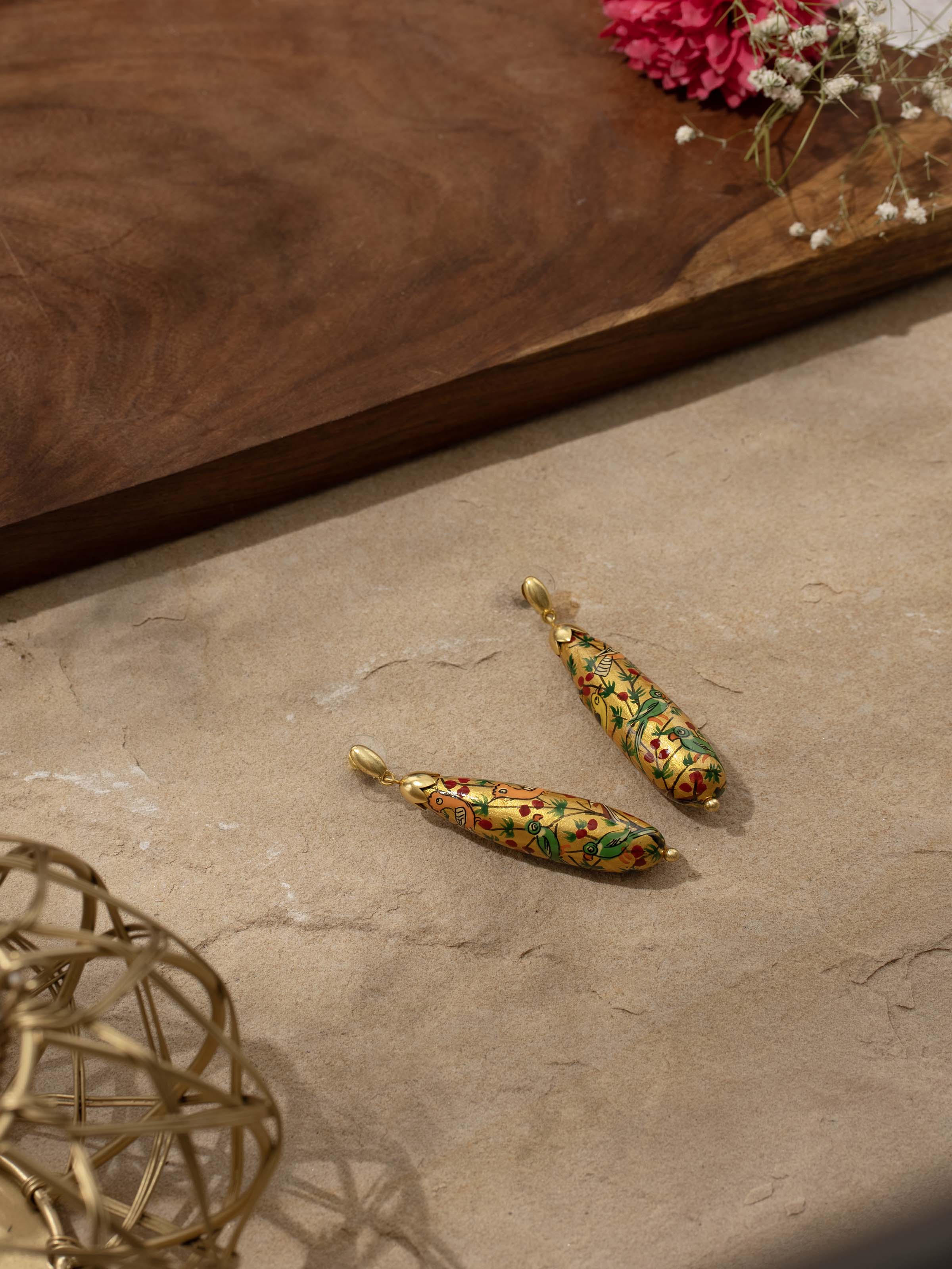 Back view of Papier-mâché Drop Earrings showing hook and design details.