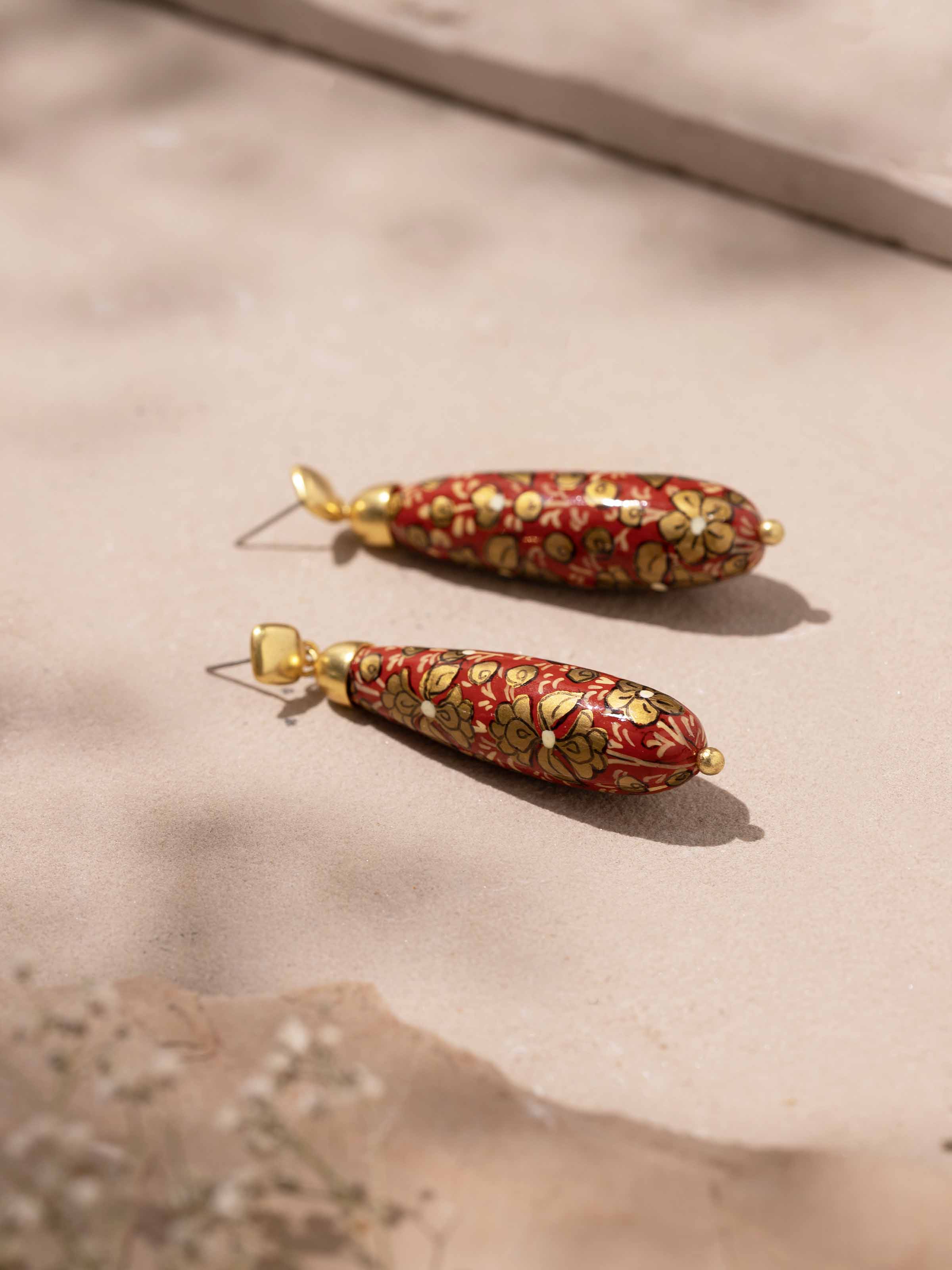 Detailed view of Papier-mâché Drop Earrings showcasing the craftsmanship and vibrant design elements.