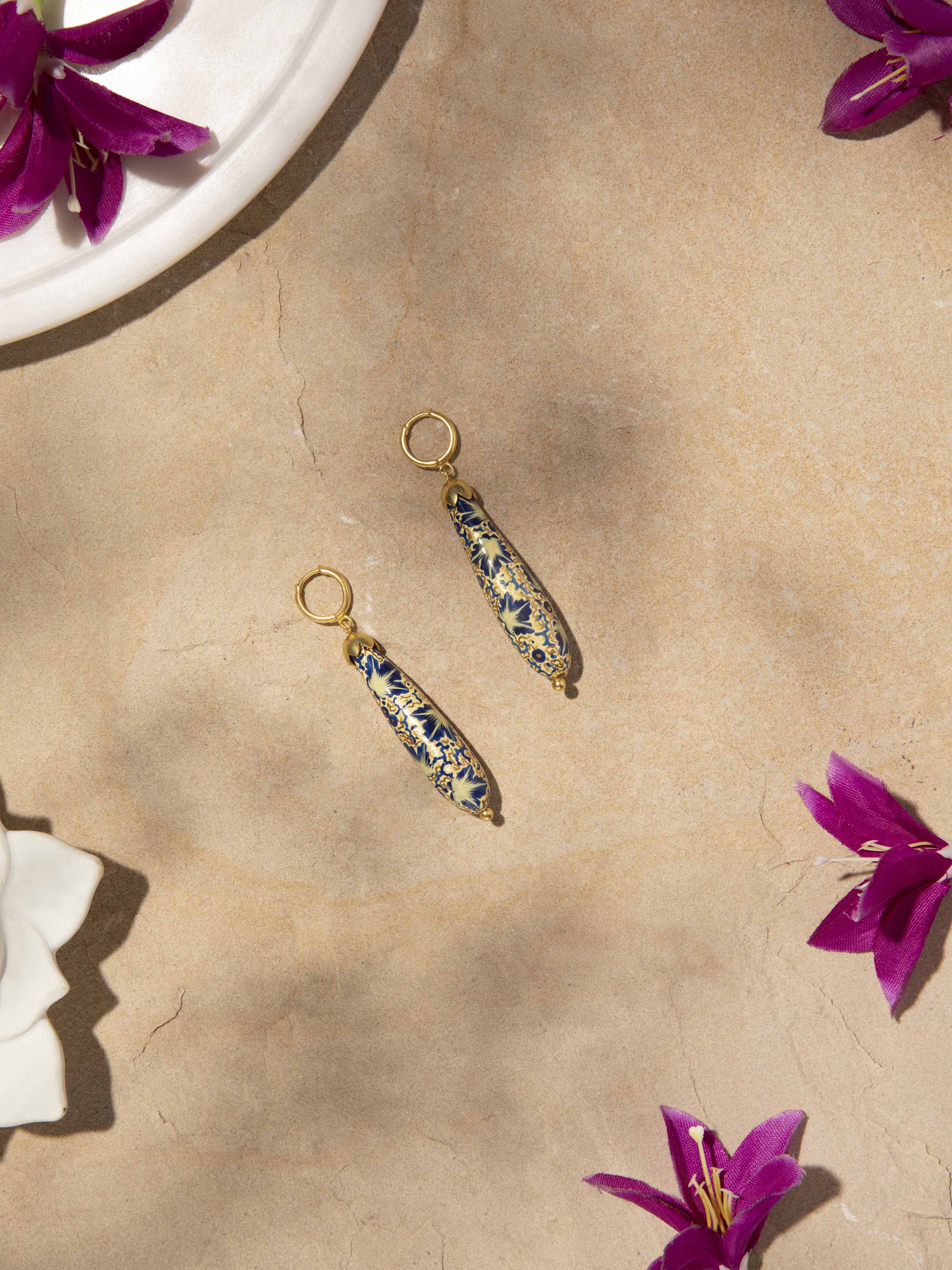 Side view of Papier-Mâché Drop Earrings showcasing their drop design and detailed artistry.