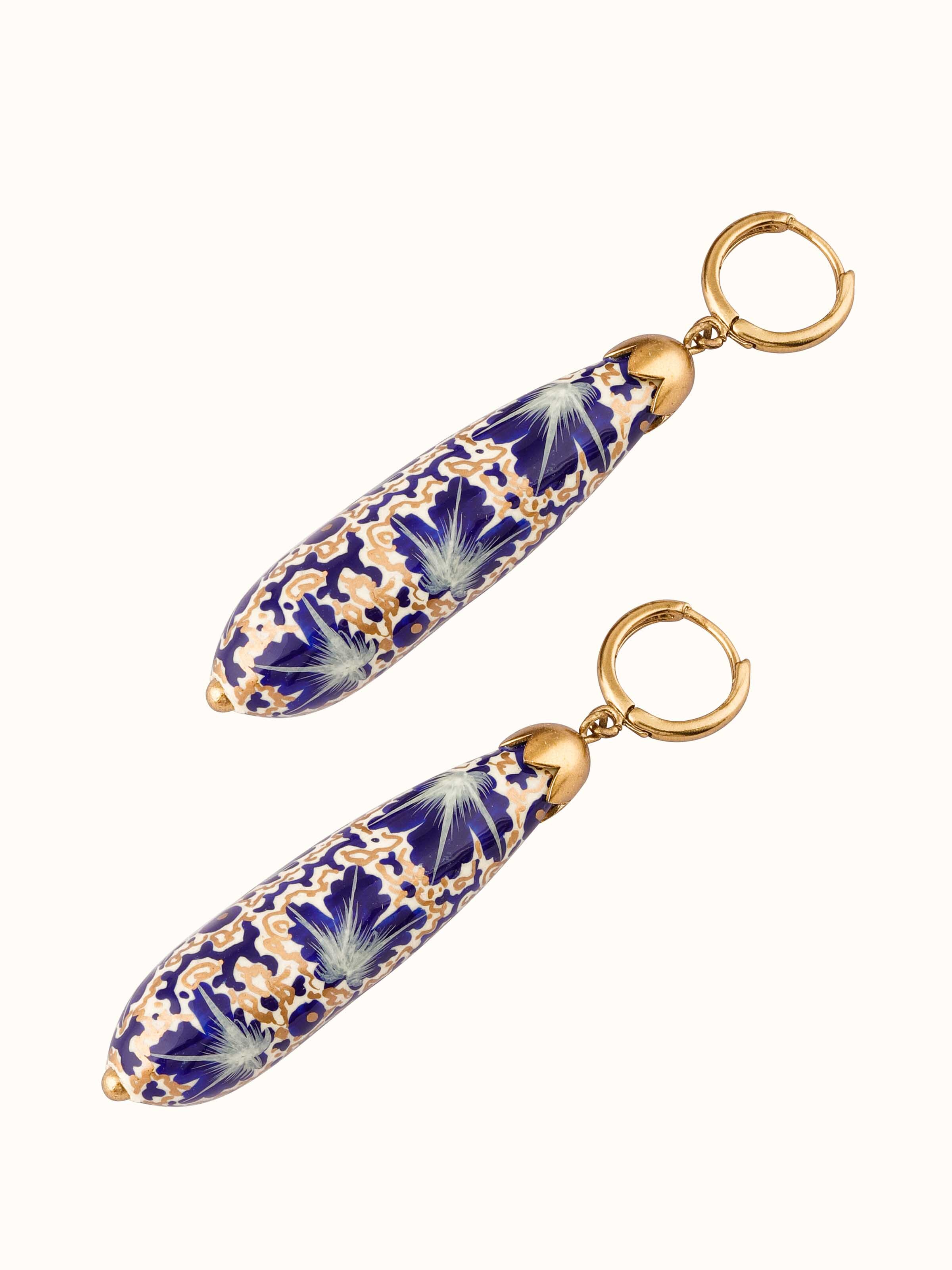 Angled view of Papier-Mâché Drop Earrings highlighting vibrant colors and intricate design.