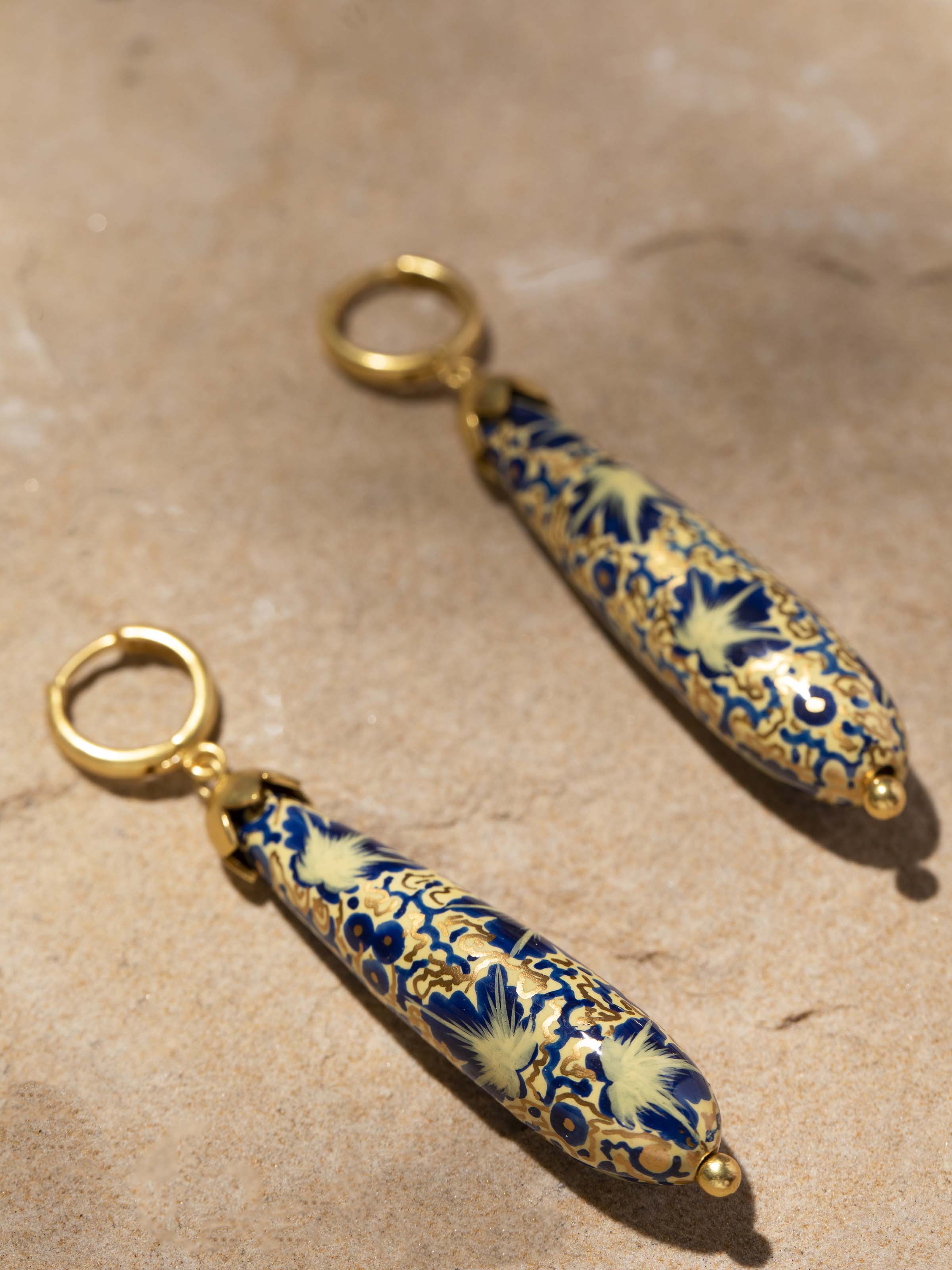 Detailed view of Papier-Mâché Drop Earrings focusing on craftsmanship and unique texture.