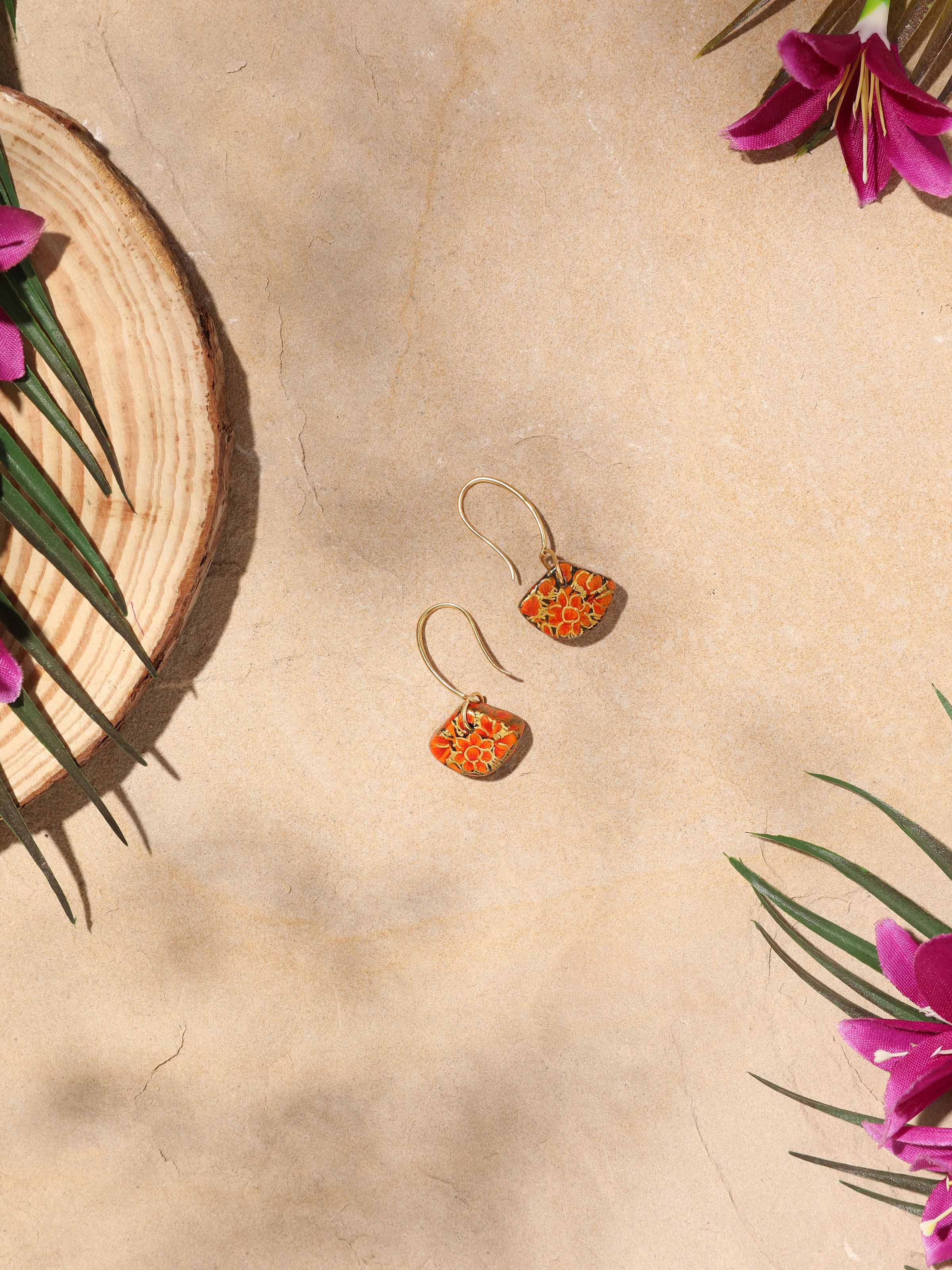 Close-up view of Papier-mâché Drop Earrings highlighting fine details and artistic design