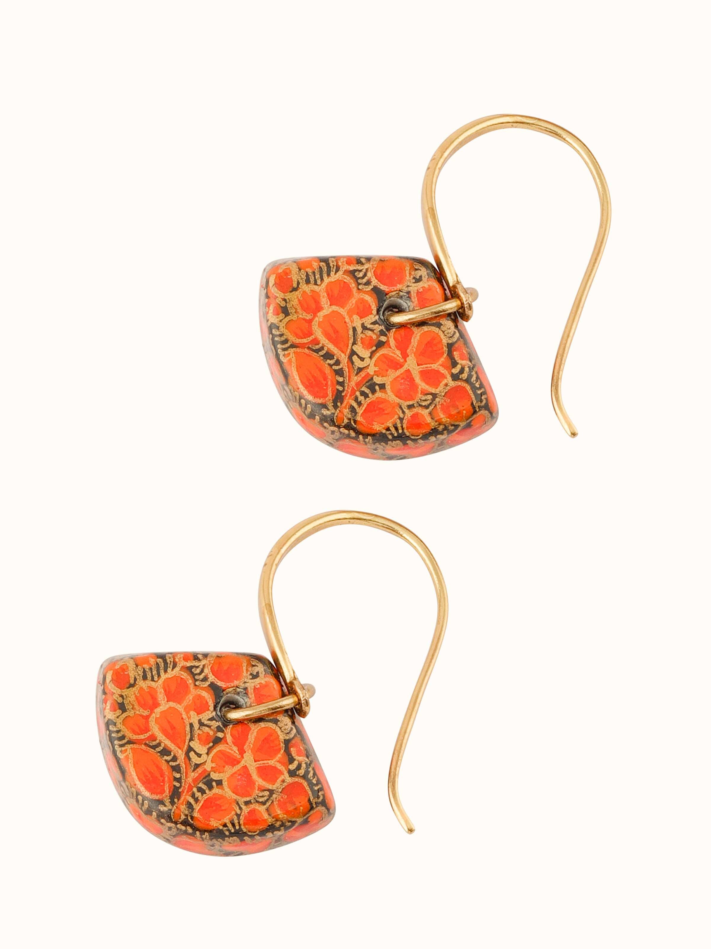 Overhead view of Papier-mâché Drop Earrings displaying their full design and colorful patterns