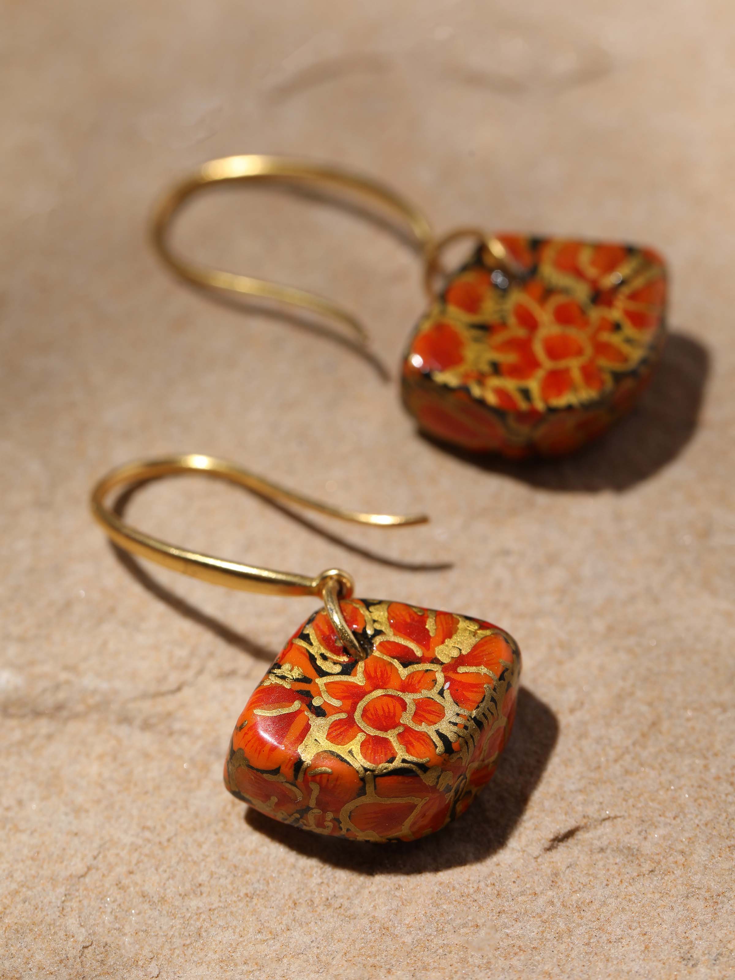 Detailed view of Papier-mâché Drop Earrings with a focus on intricate patterns and vibrant colors