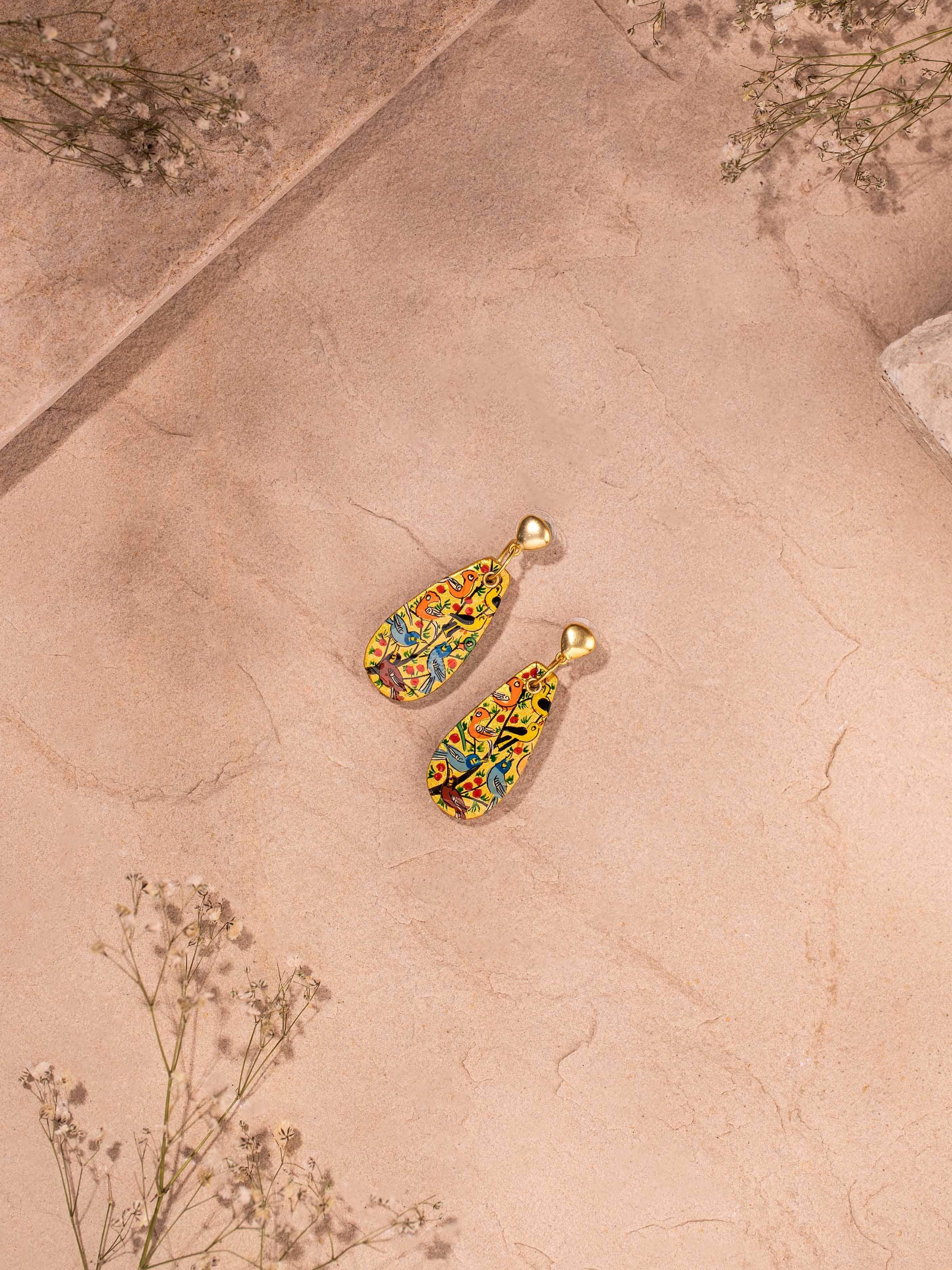 Side view of Papier-mâché Drop Earrings illustrating their drop style.