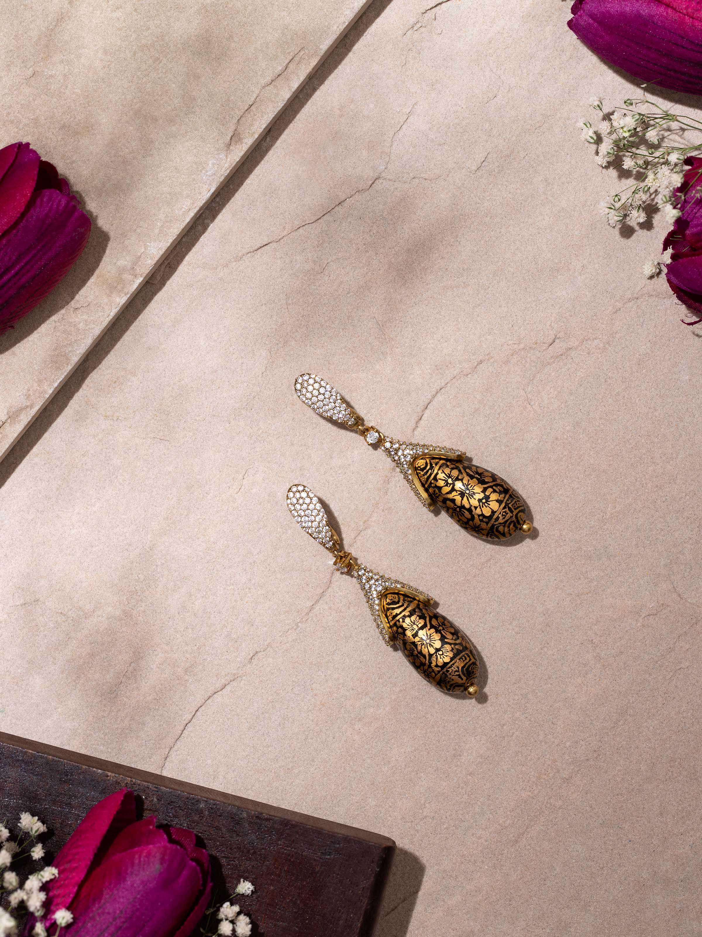 Close-up view of Papier-mâché Drop Earrings highlighting the detailed paper-mâché artistry and colorful patterns.