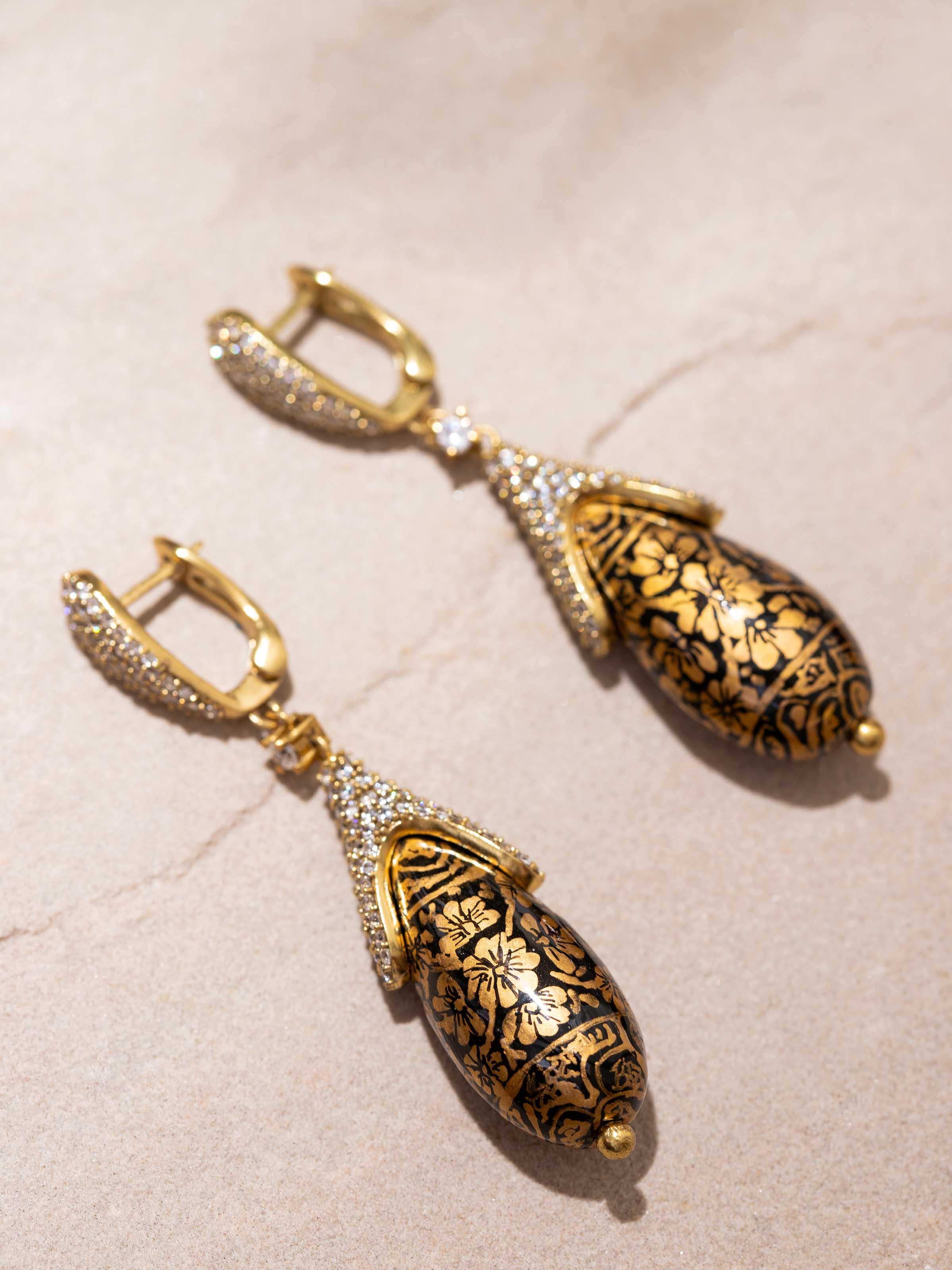 Angled view of Papier-mâché Drop Earrings emphasizing the unique design and vibrant colors.