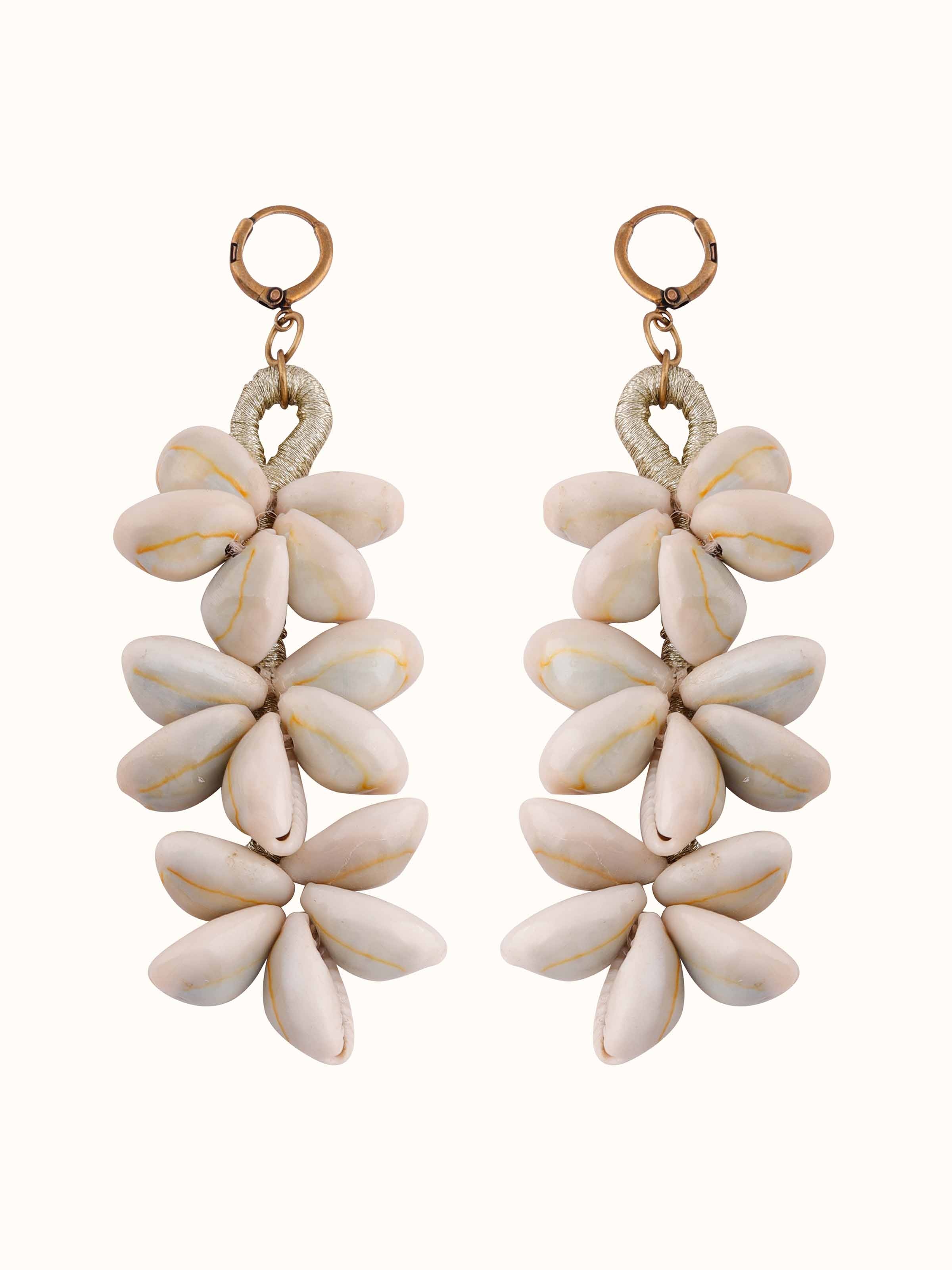 Front view of cowrie shell drop earrings featuring natural shell elements and design