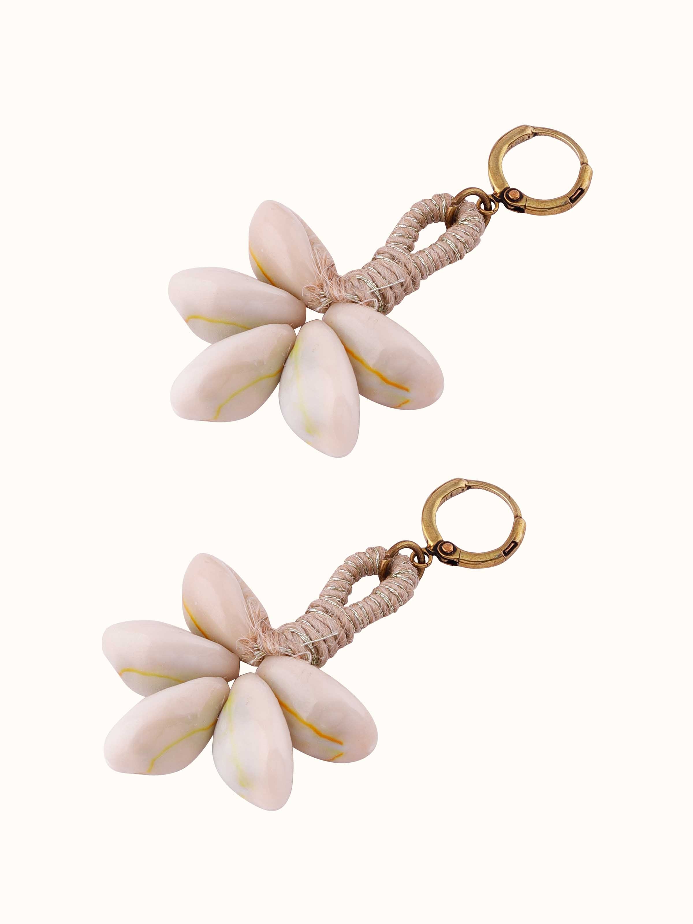 Overhead view of Cowrie Shell Drop Earrings emphasizing the shell's natural shape and elegant drop style.