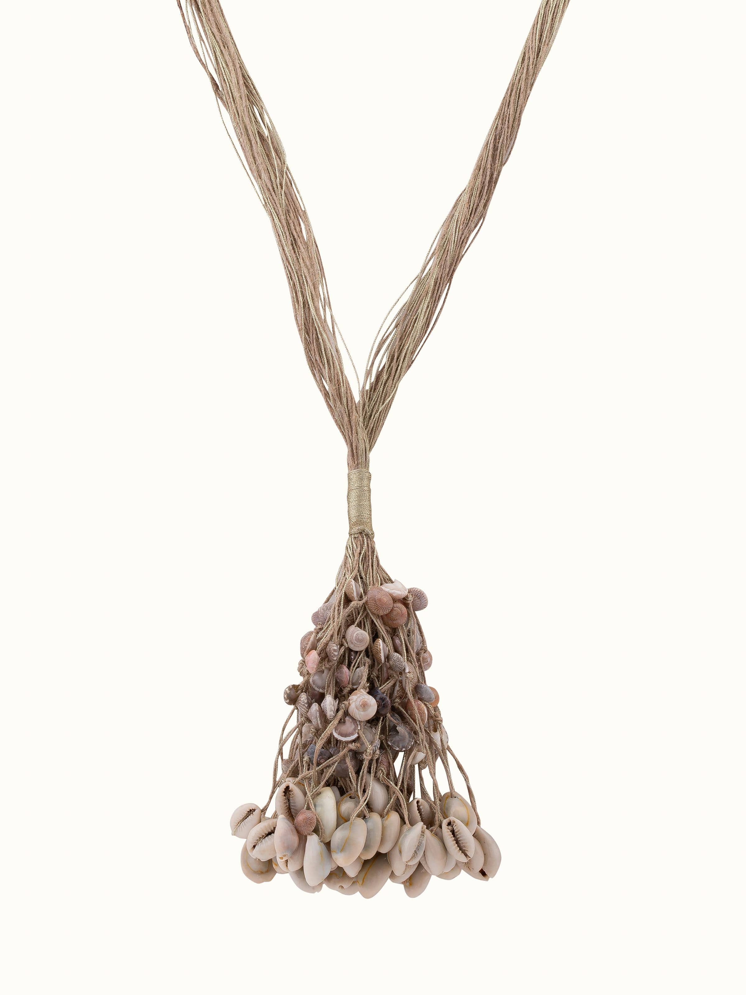 "Front view of cowrie shell long necklace showcasing its elegant design"