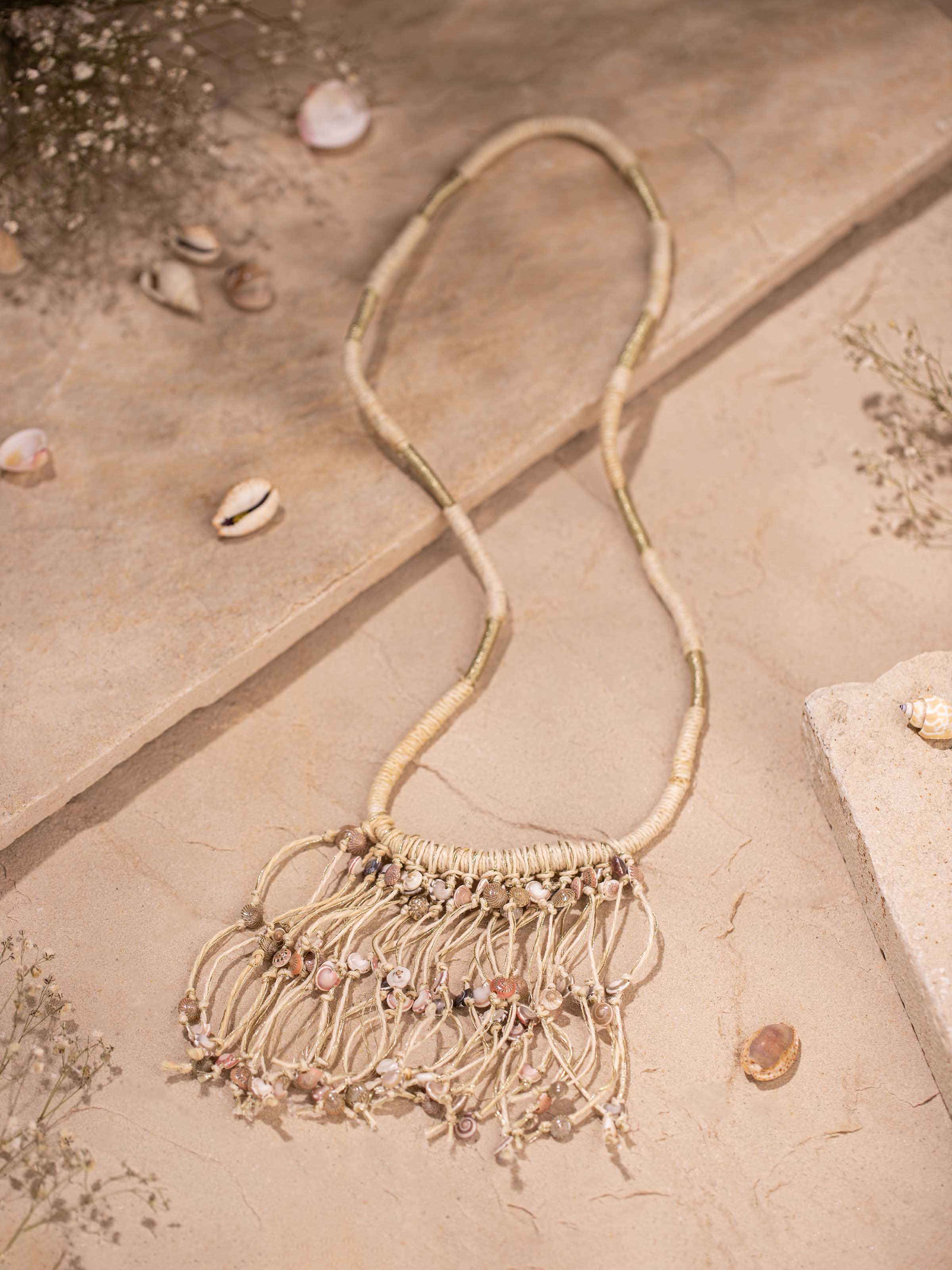 Close-up of Cowrie Shell Drop Earrings showcasing detailed shell design and craftsmanship.