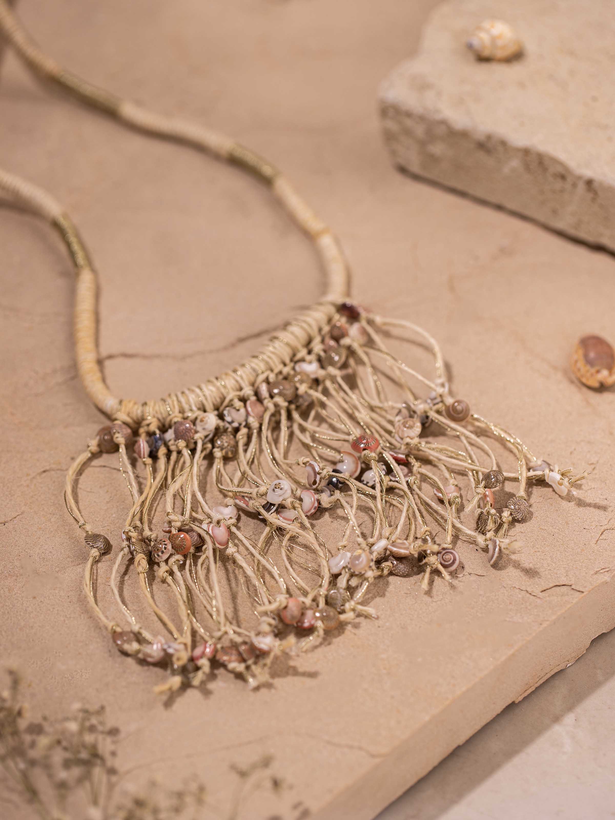 details of Cowrie Shell Drop Earrings showcasing detailed shell design and craftsmanship.