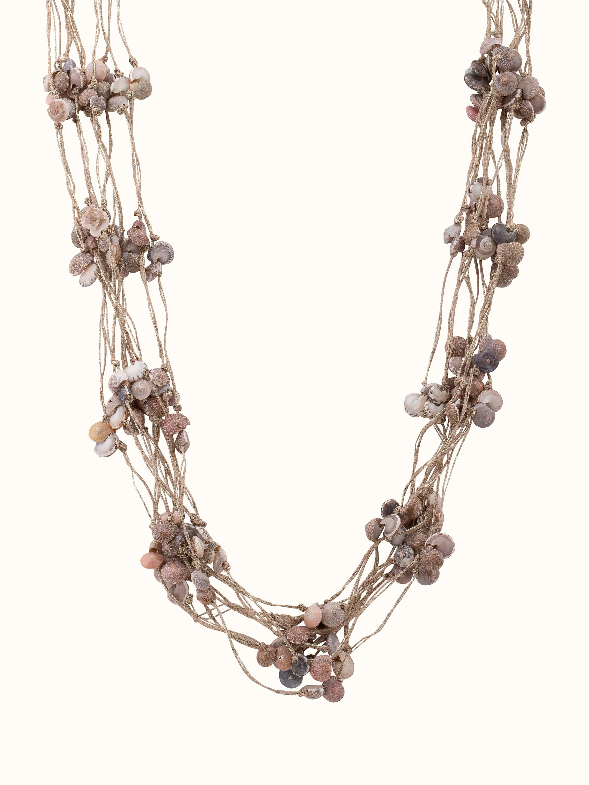 Front view of cowrie shell long necklace highlighting its natural beauty and intricate design.