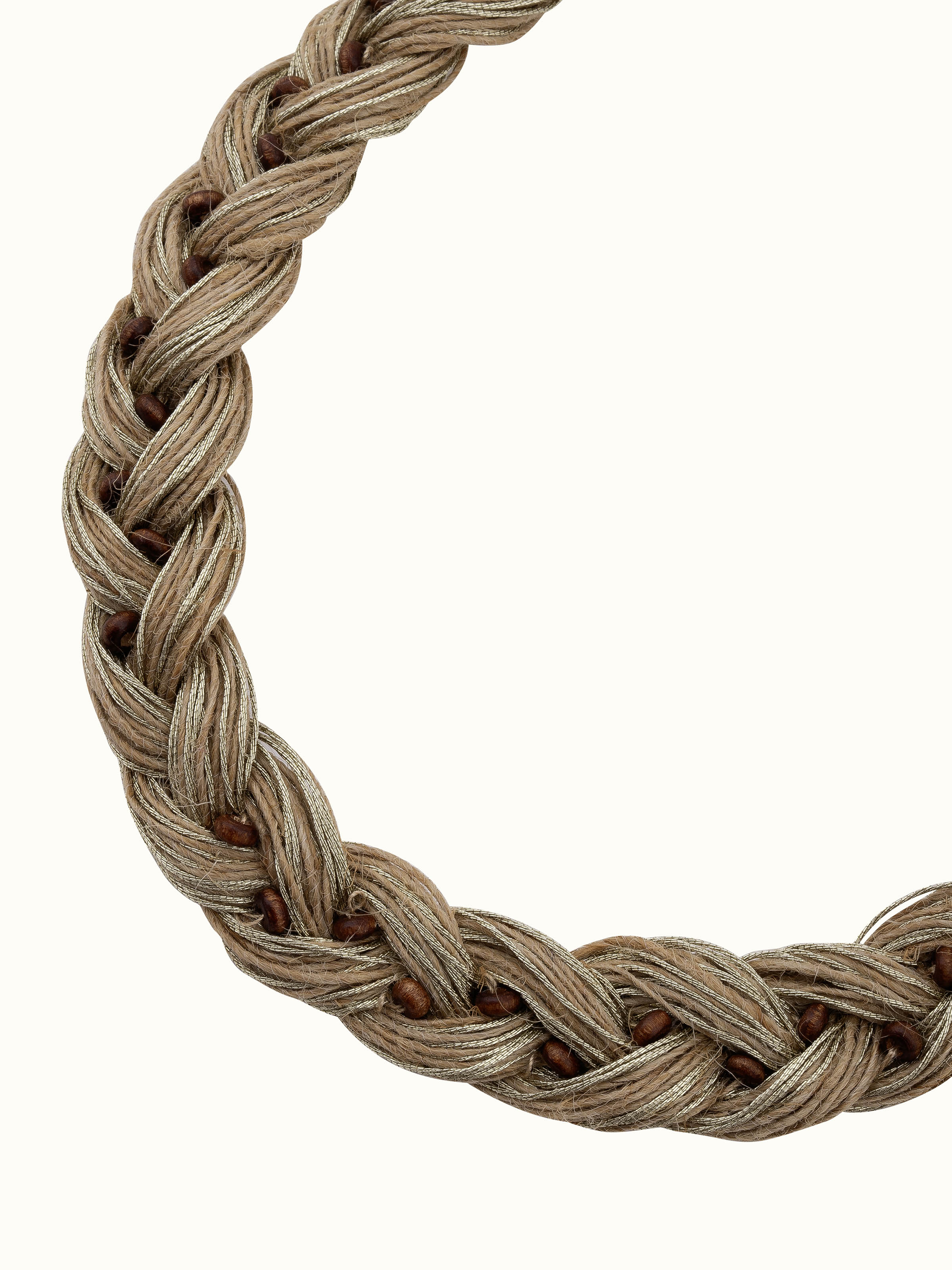 Jute jewellery collar necklace displayed on a flat surface to show its detailed design and natural materials.