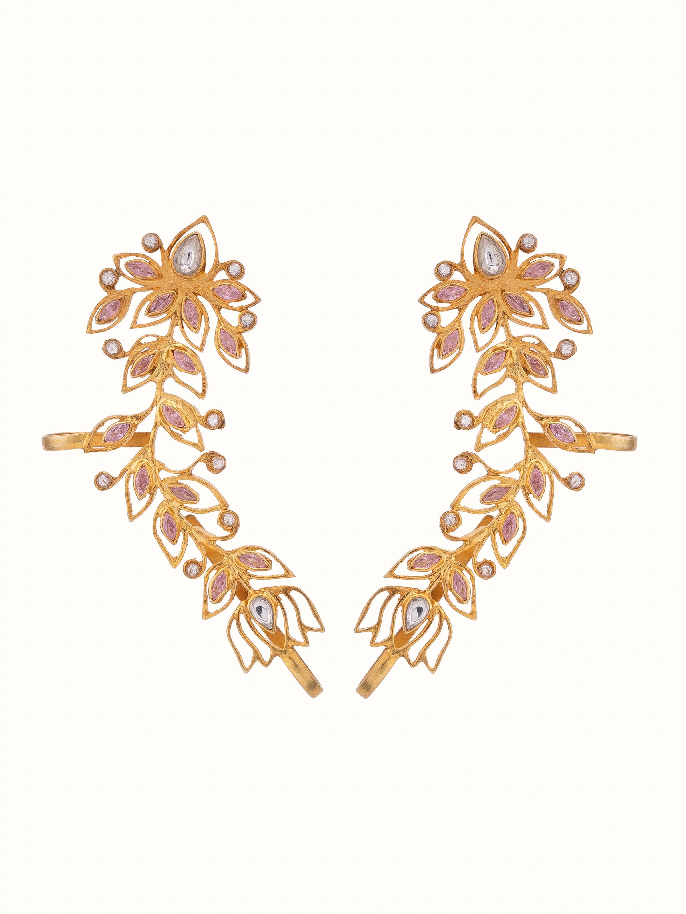 Front view of silver smithing ear cuffs showcasing intricate silver design and detailed craftsmanship.