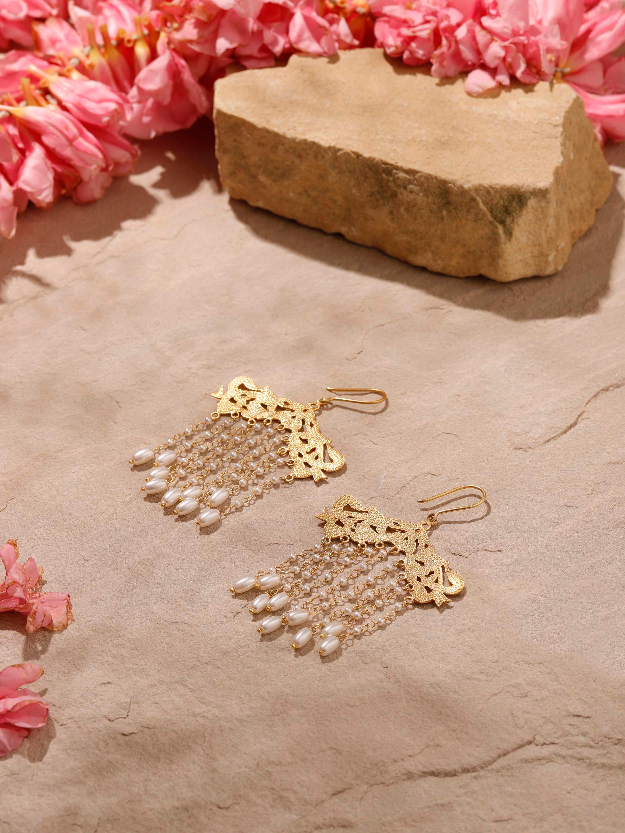 Angled view of Silver Smithing Drop Earrings showcasing their elegant and detailed silver design.